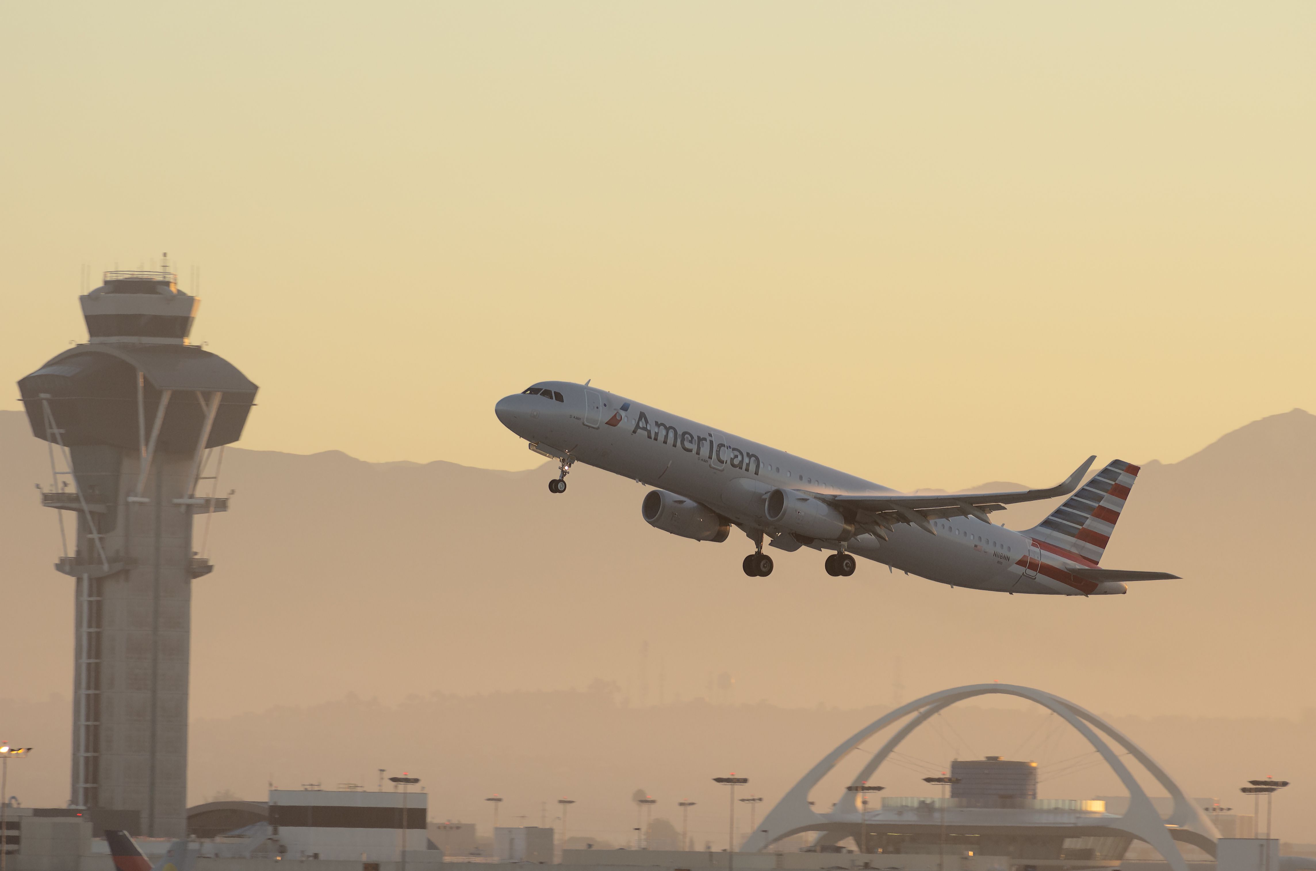 shutterstock_1370553083American Airlines Airbus A321 shown taking off from the Los Angeles International Airport, LAX, at sunrise..