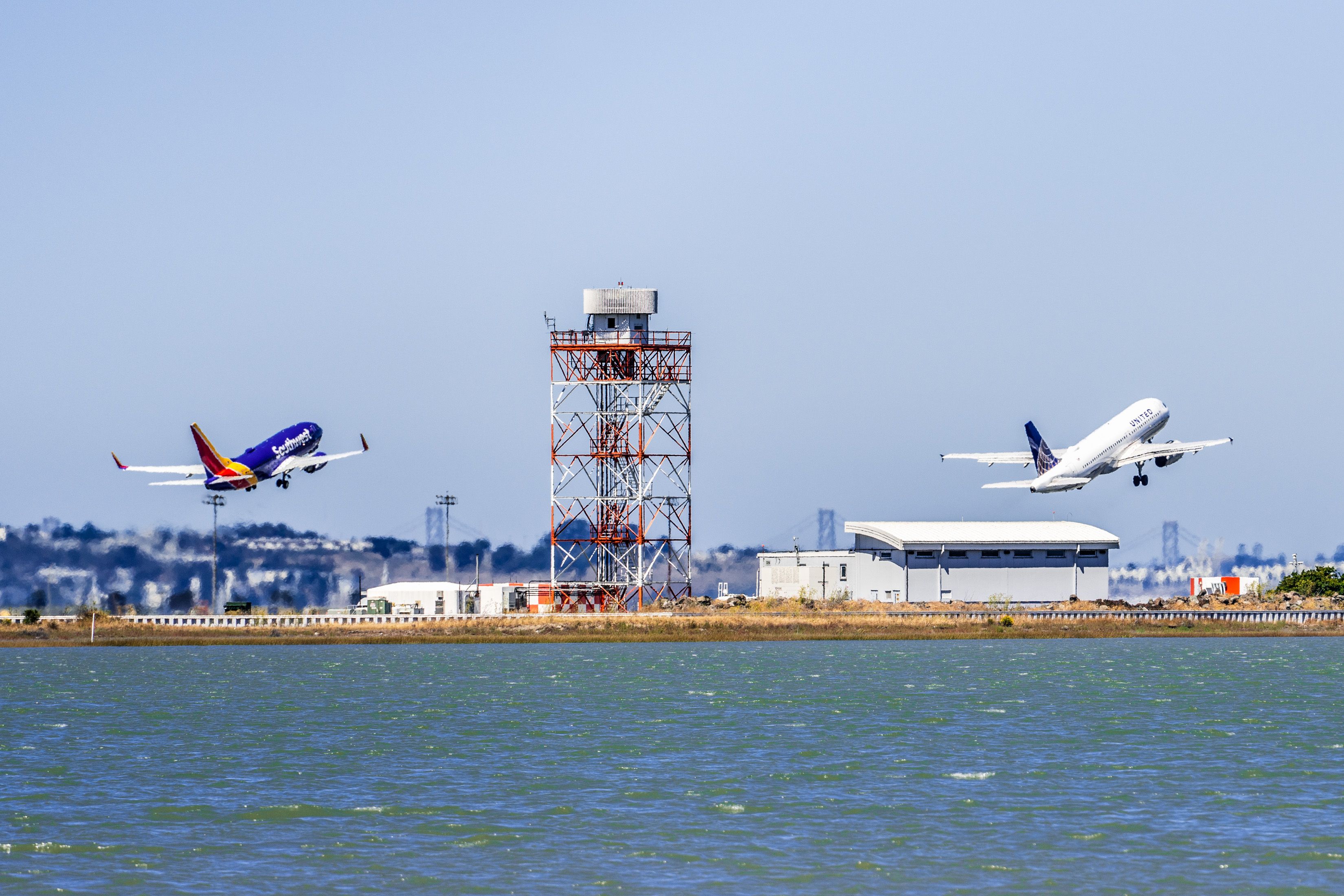 A Southwest Airlines and United Airlines plane depart San Francisco simultaneously on RNAV departures.