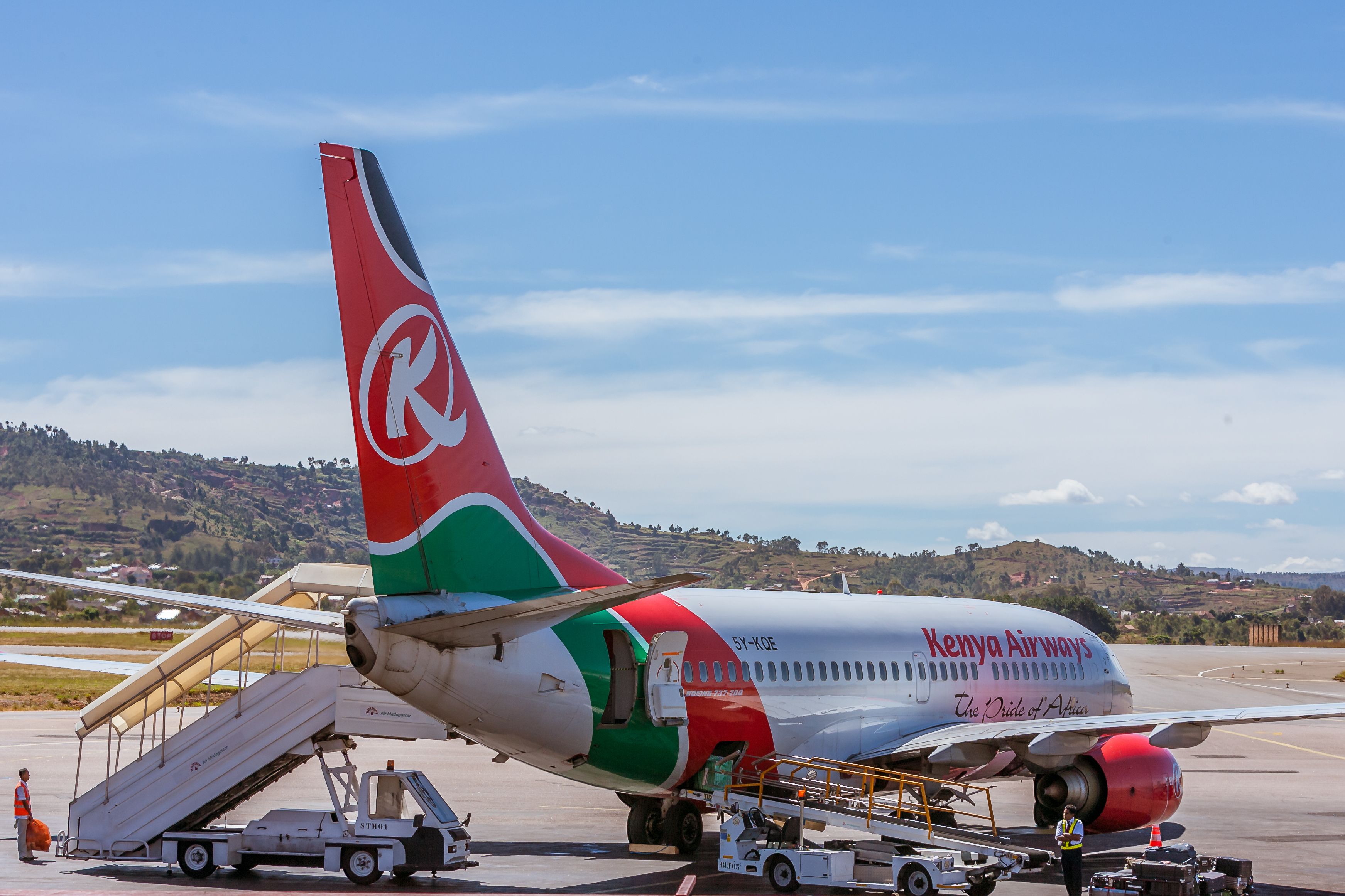 Kenya Airways Boeing 737 parked at an airfield.