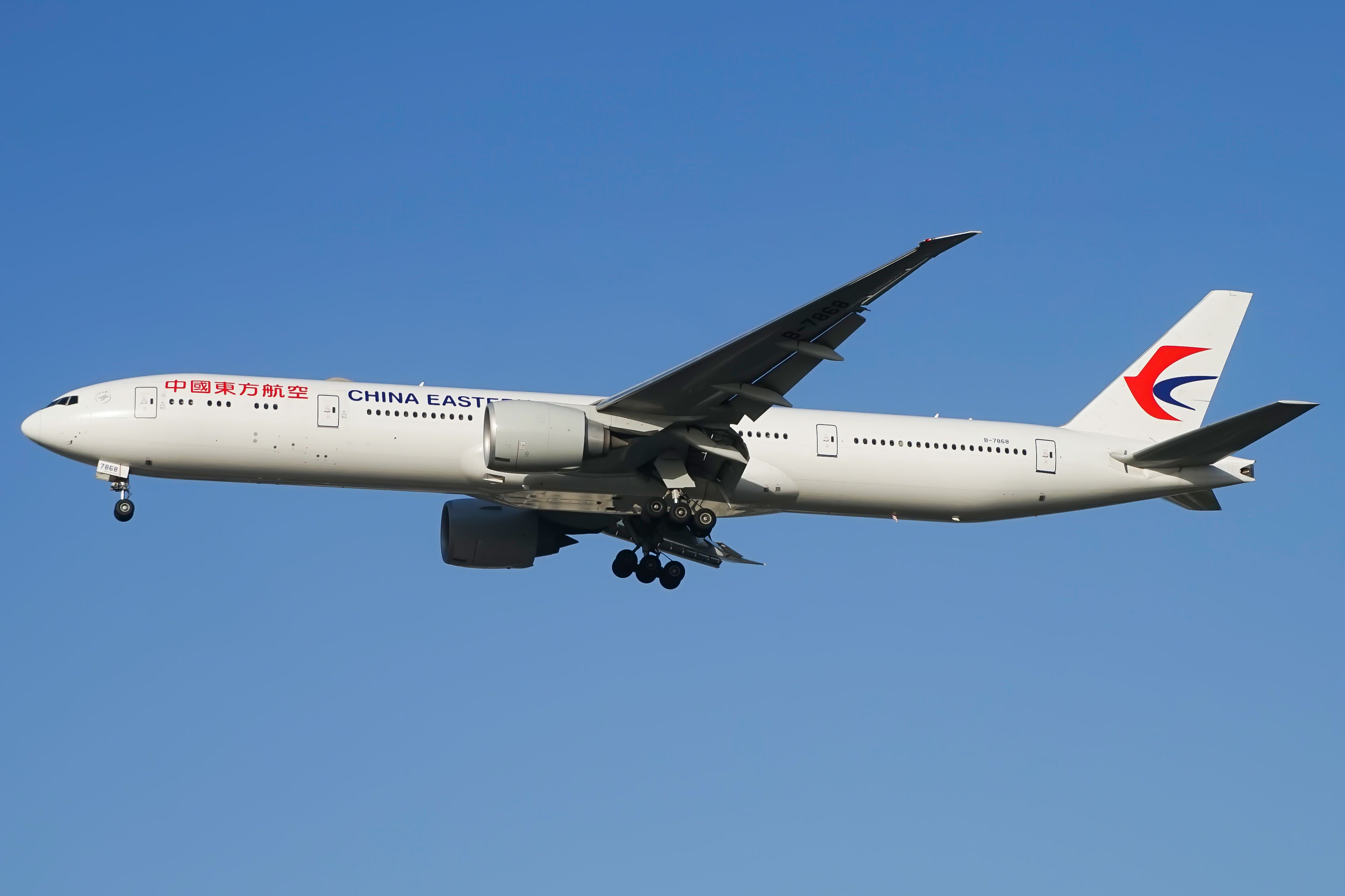 A China Eastern Boeing 777 flying in the sky.