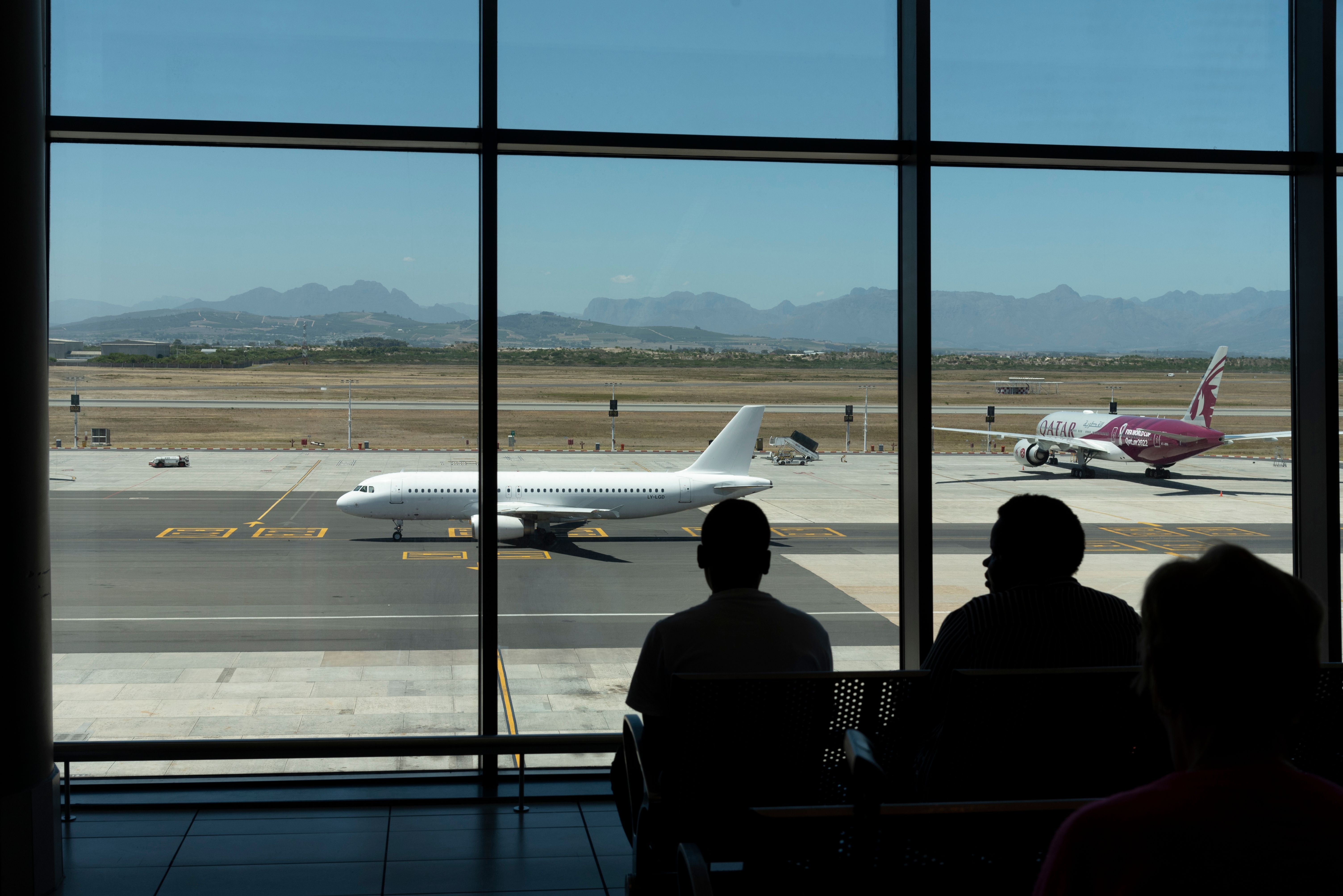 Cape Town South Africa. 2023. Spectators sitting in airport viewing area watch aircraft movements and spectacular view.