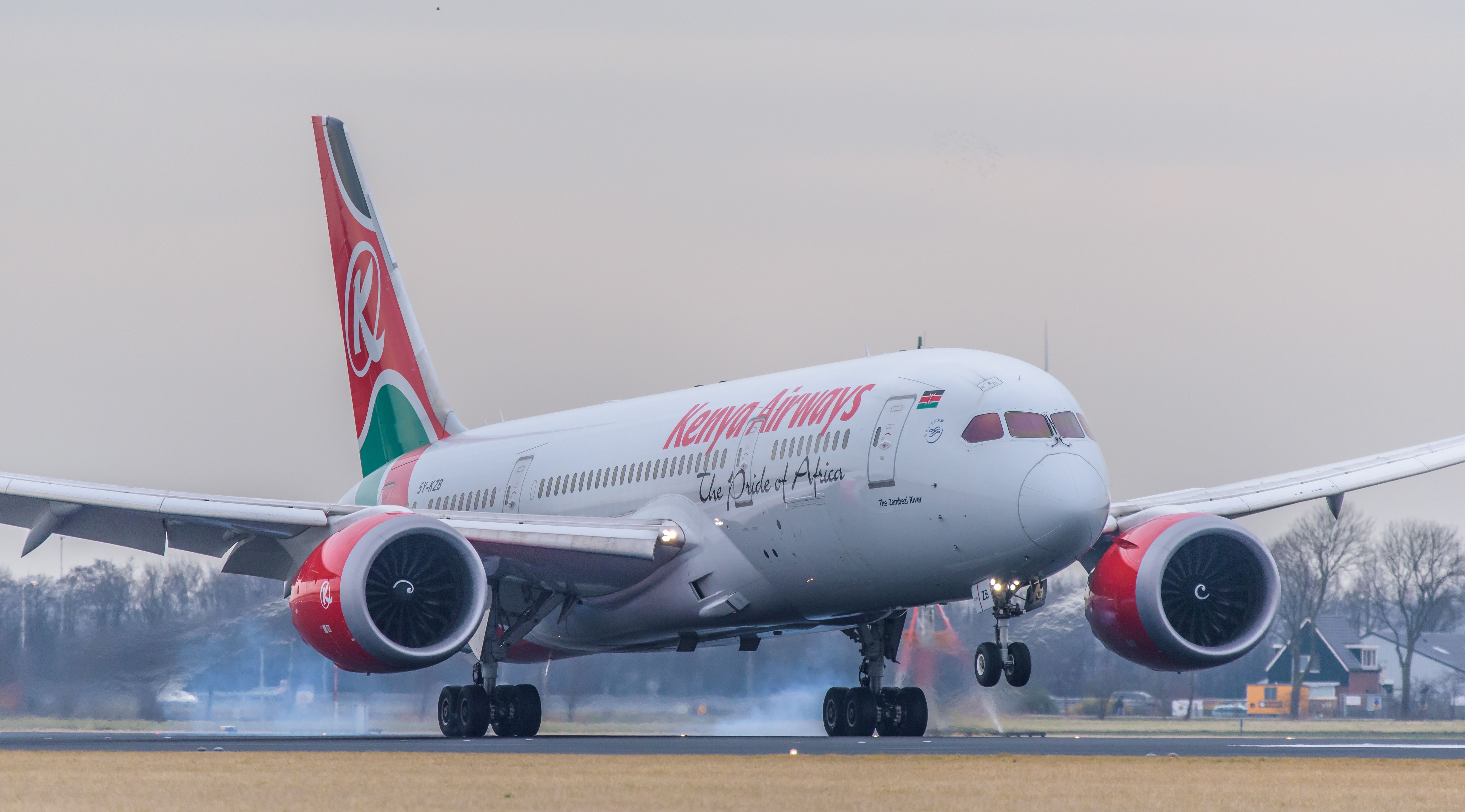 A Kenya Airways aircraft landing at Schiphol Airport.
