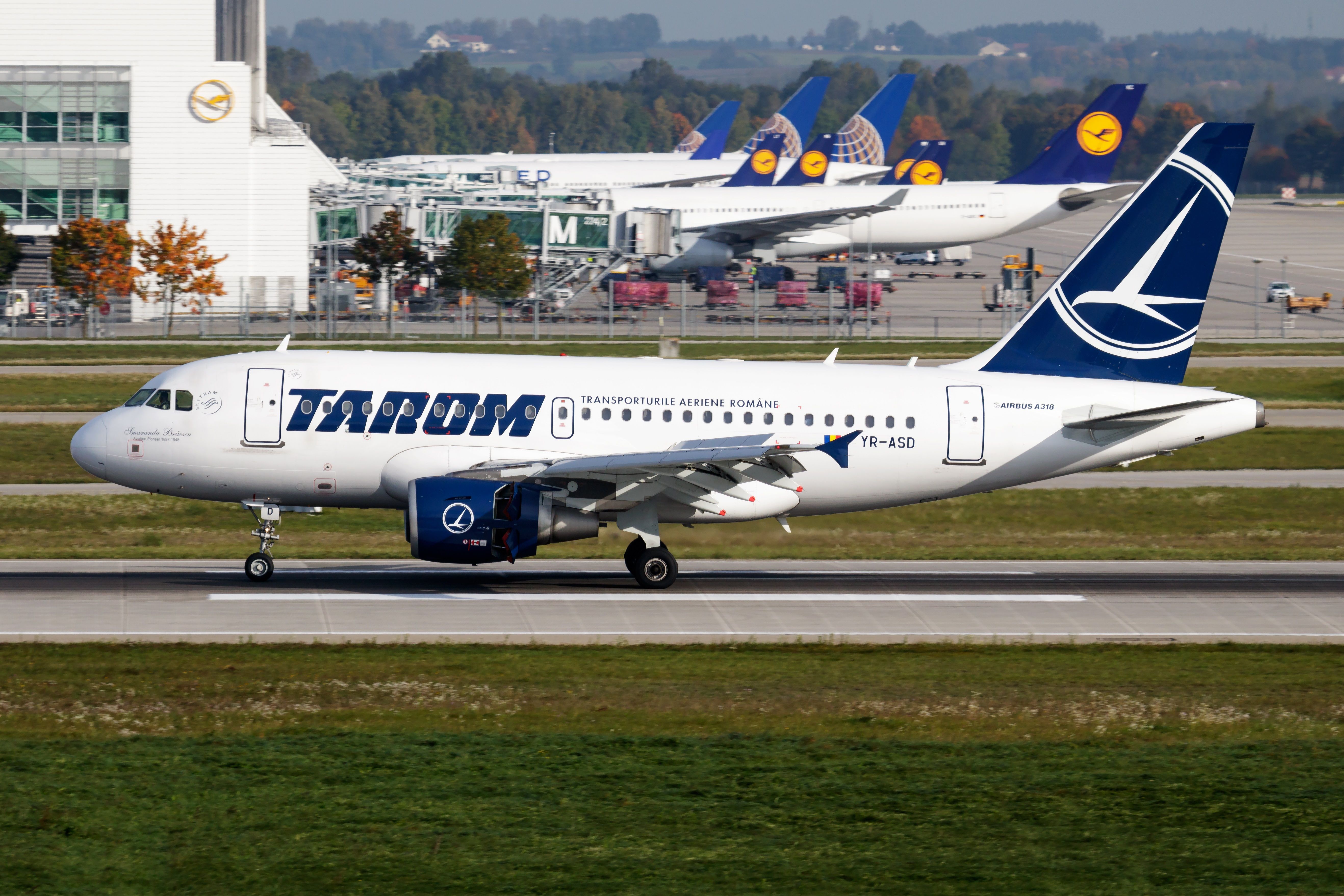 A TAROM A318 rolling down the runway.