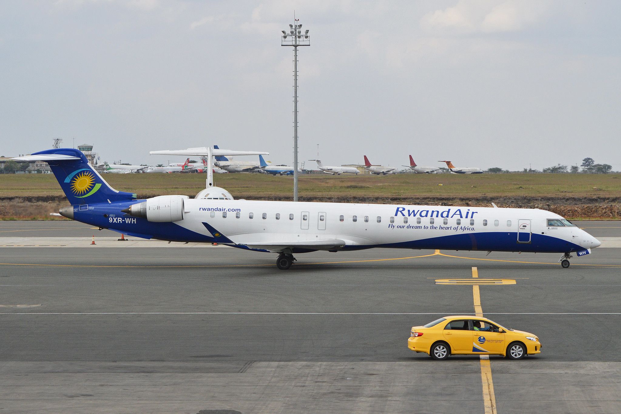 A Rwandair Bombardier CRJ900 taxiing to the runway.