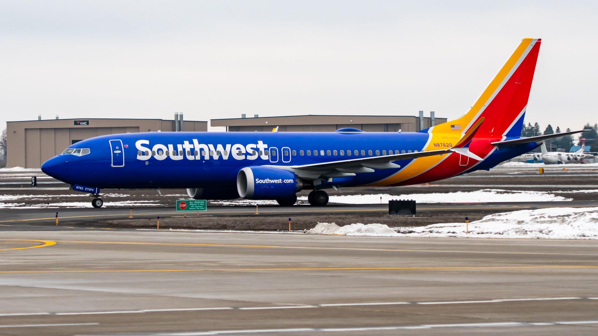 A Southwest Airlines' 737 MAX 8 taxiing at snowy Spokane International Airport (GEG)