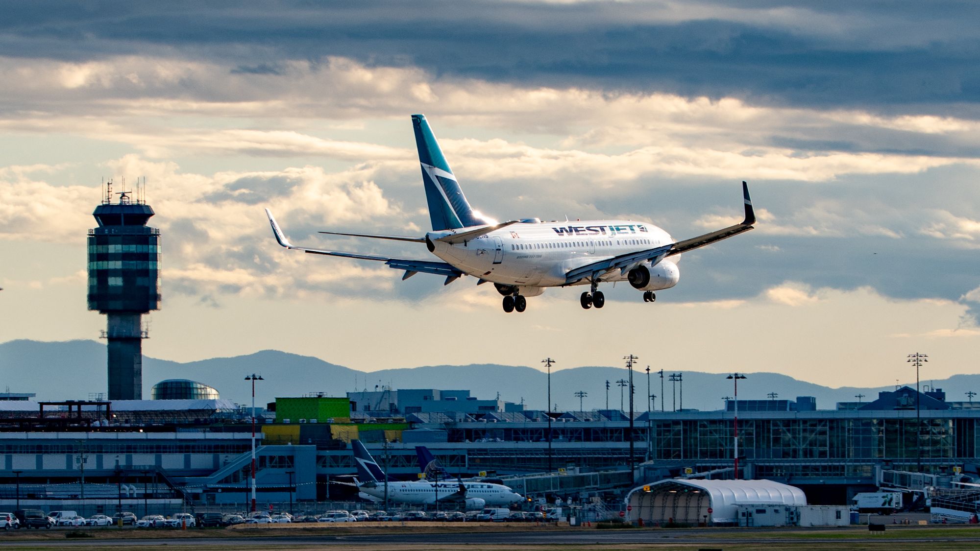 WestJet Boeing 737-700 on Short Final Past YVR Construction and Air Control Tower - 2019-06-18