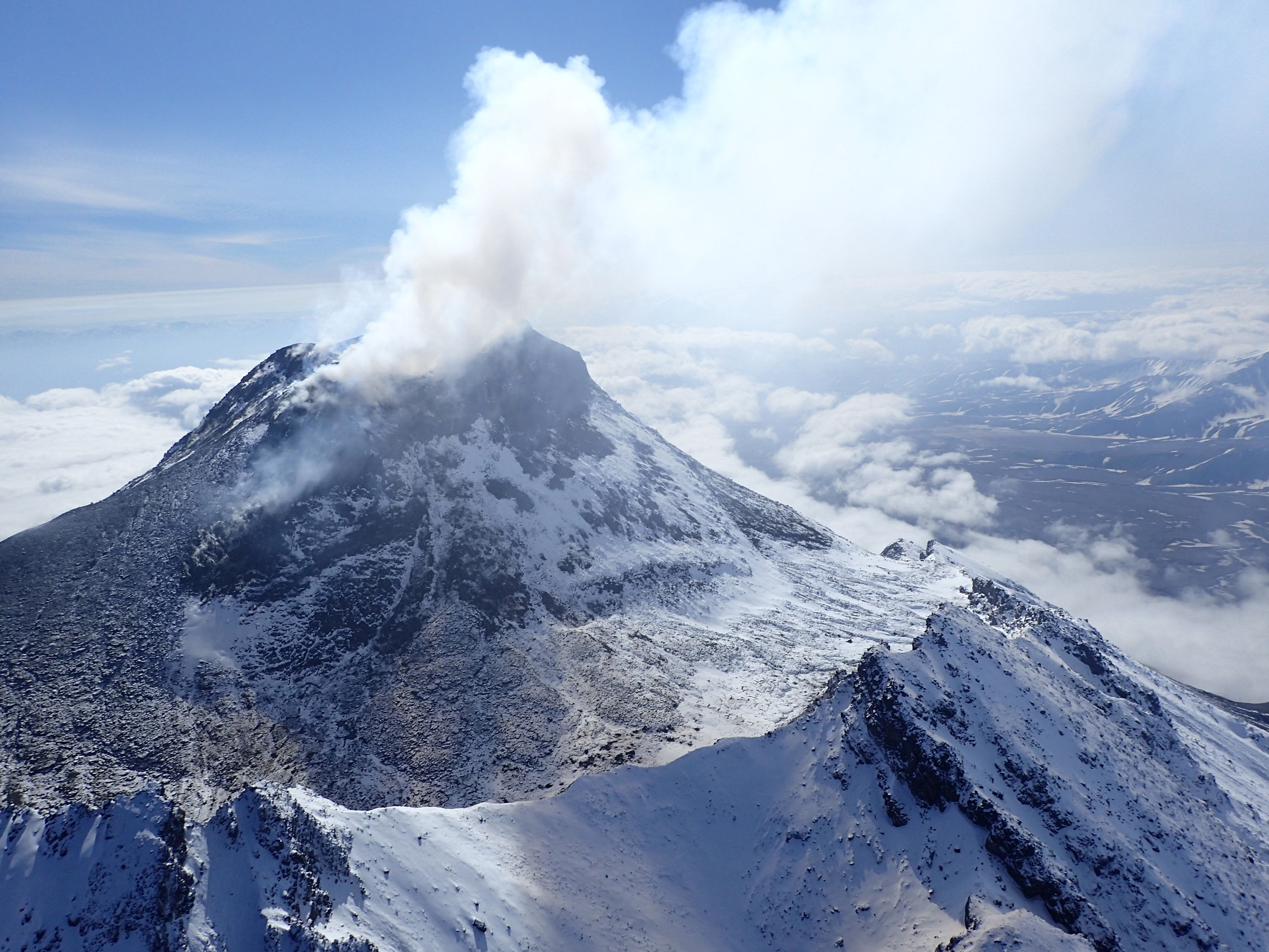 Aerial view of the Bezymianny volcano erupting.