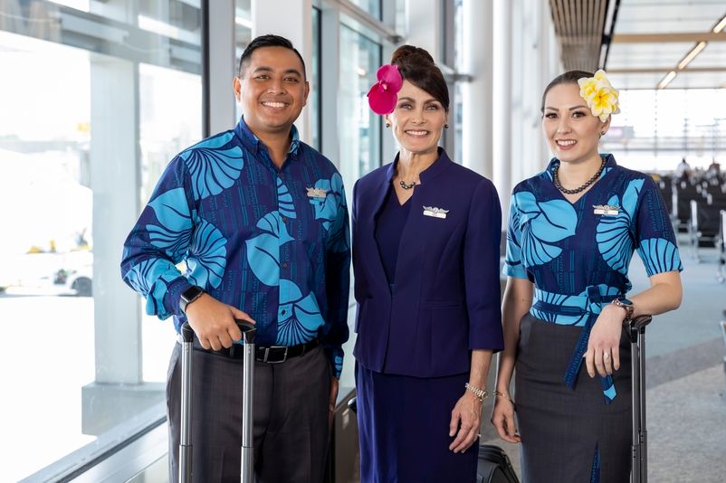 Hawaiian Airlines flight attendants inside an airport terminal.