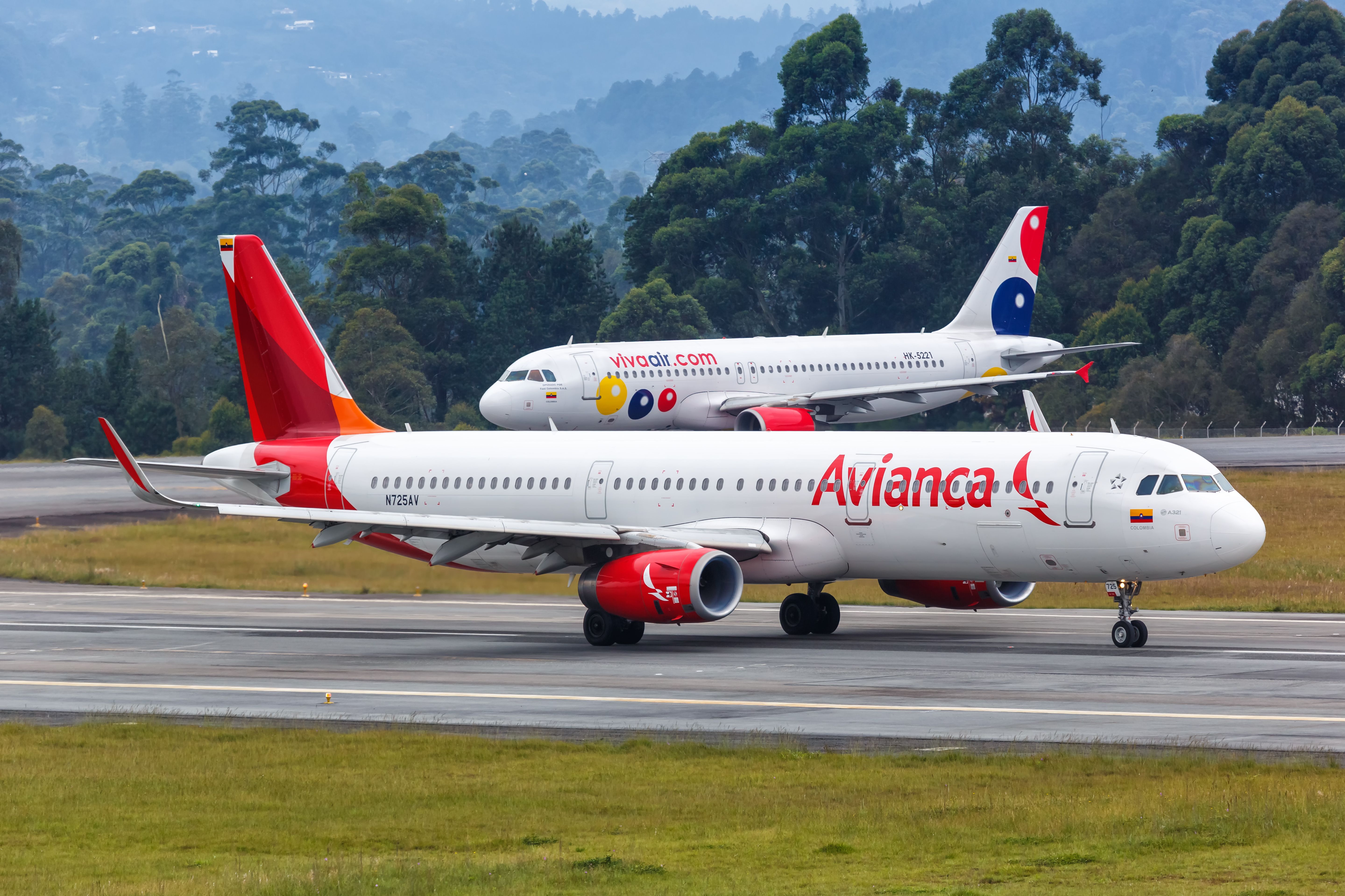 An Avianca and a Viva Air plane seen at Medellin International 