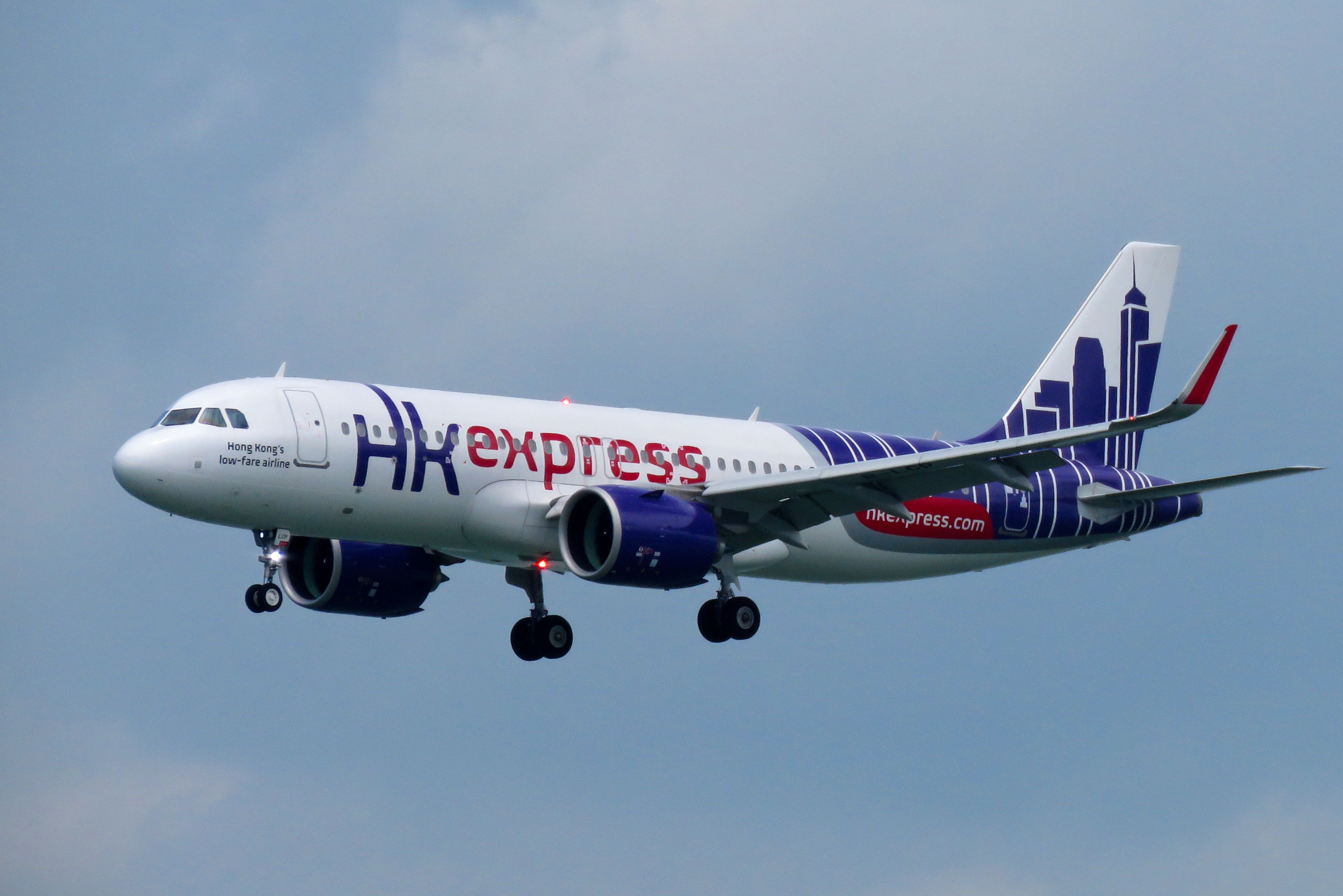HK Express A320 flying in the sky.