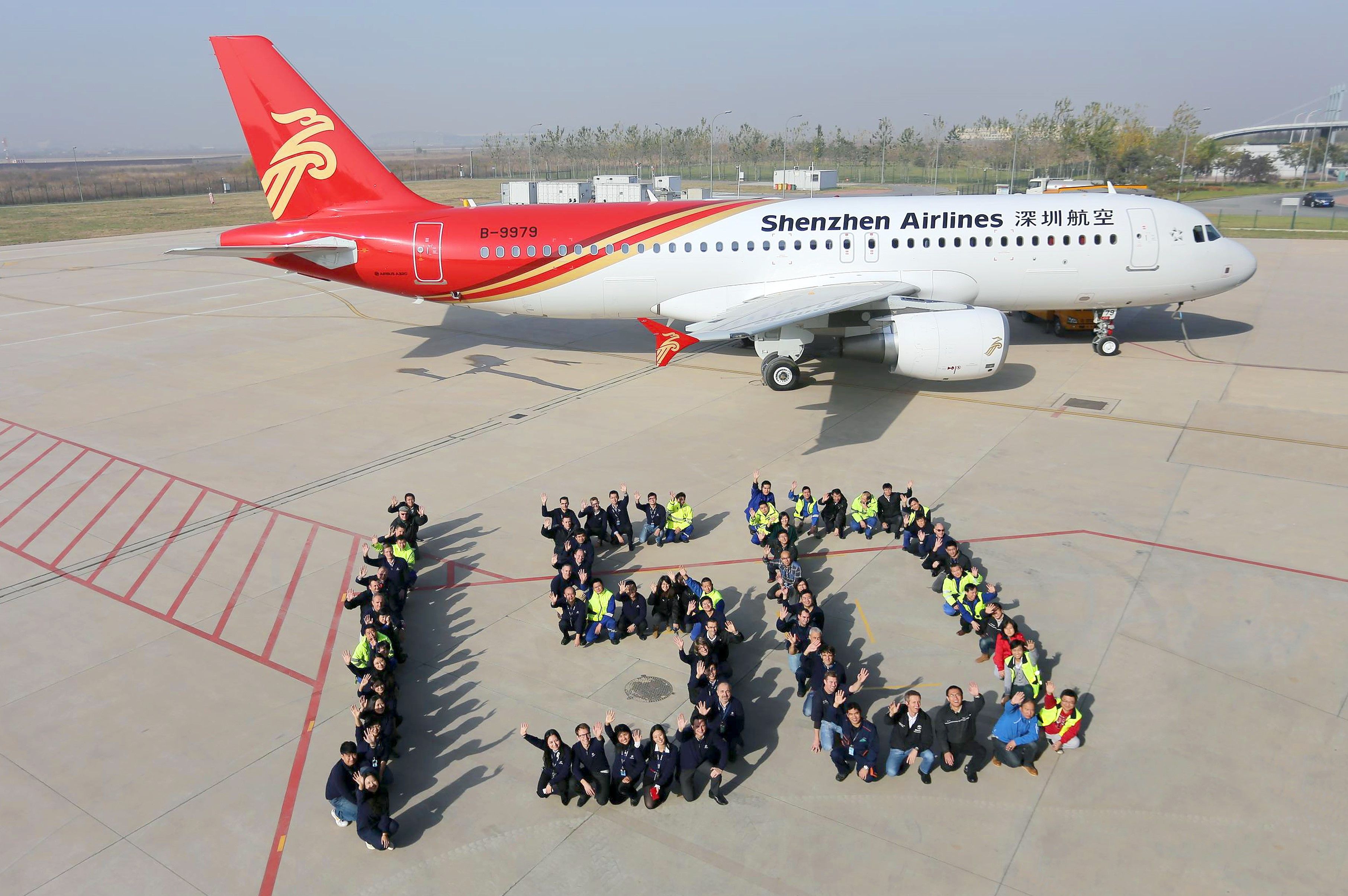 A Shenzhen Airlines Airbus A320 parked at an airfield.