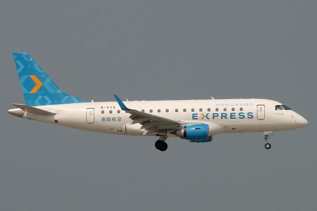 A Hong Kong Express Embraer E170 flying in the sky.
