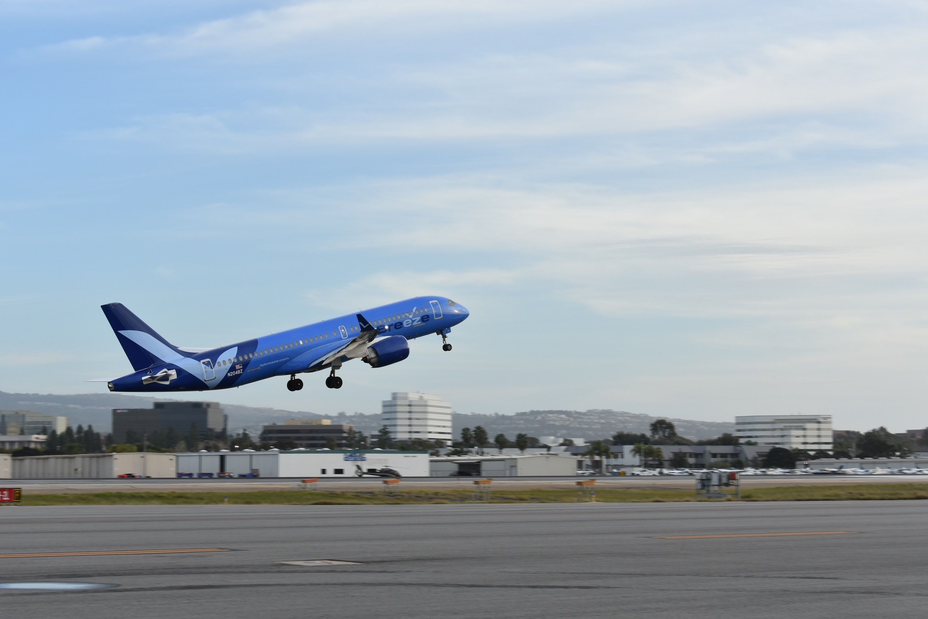 Breeze Airways Airbus A220-300 taking off from John Wayne Airport. 