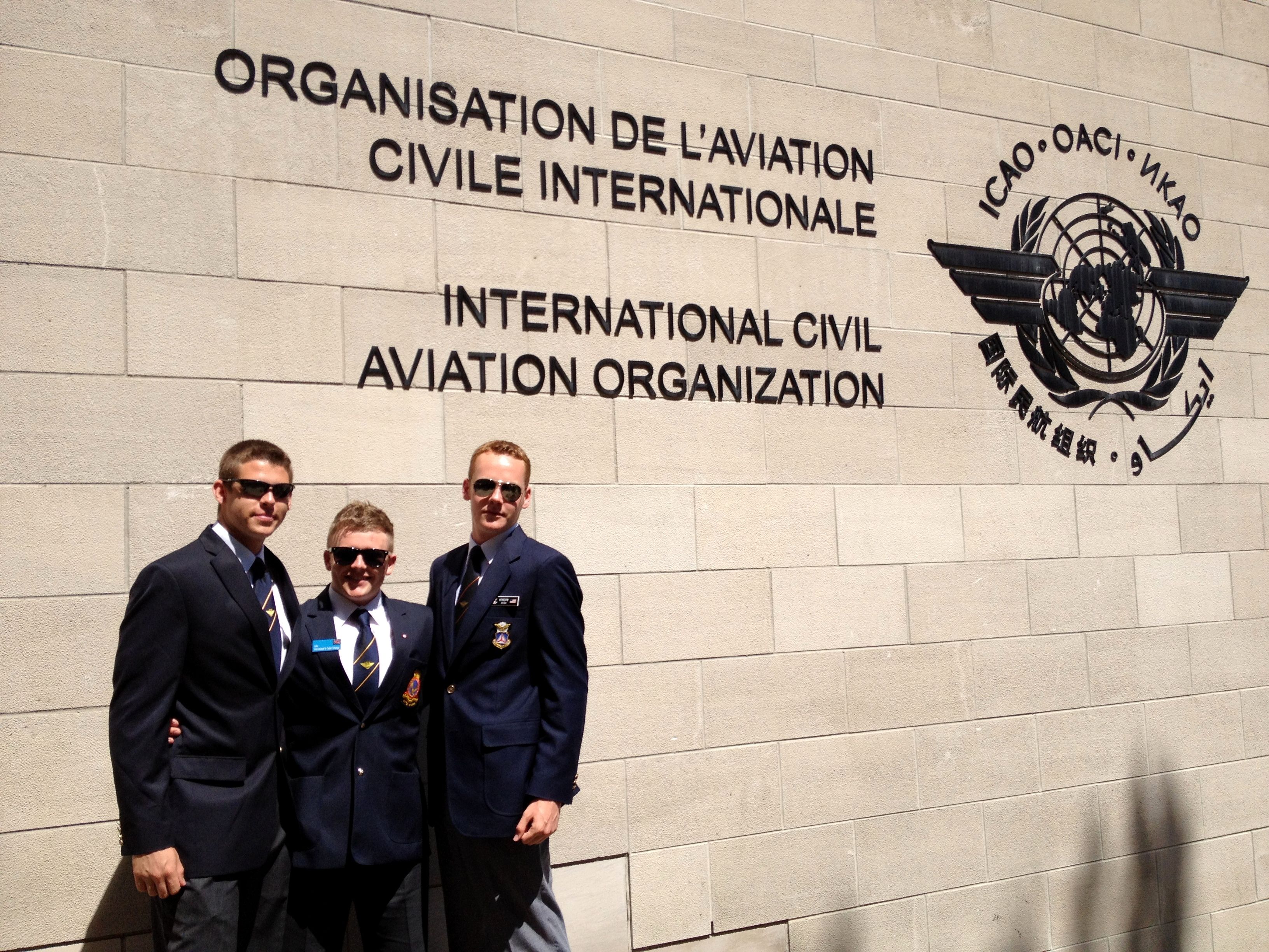 Simple Flying's Jonathan Hendry, with two others, outside the ICAO Headquarters