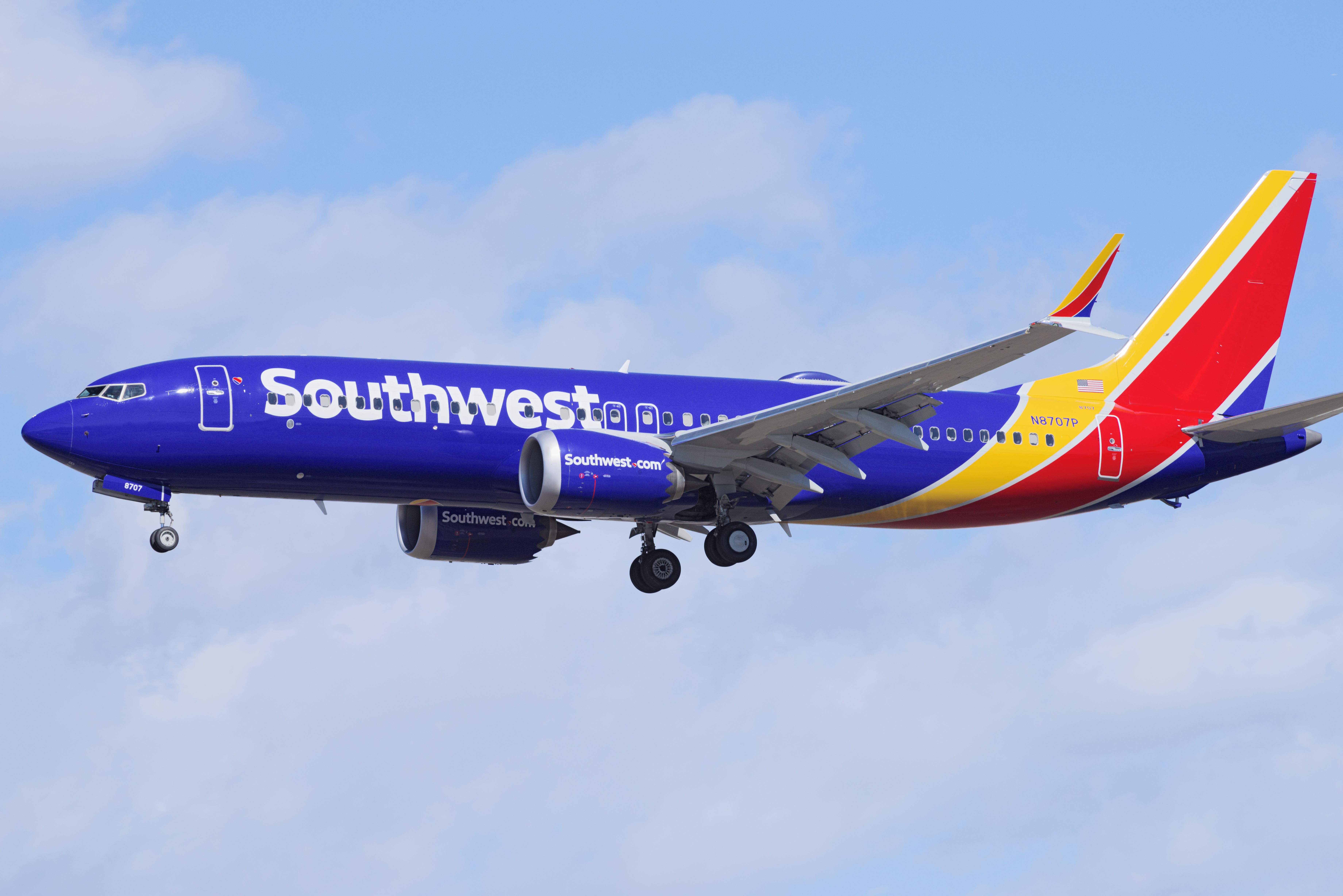 A Southwest Airlines Boeing 737 MAX 8 flying in the sky. 