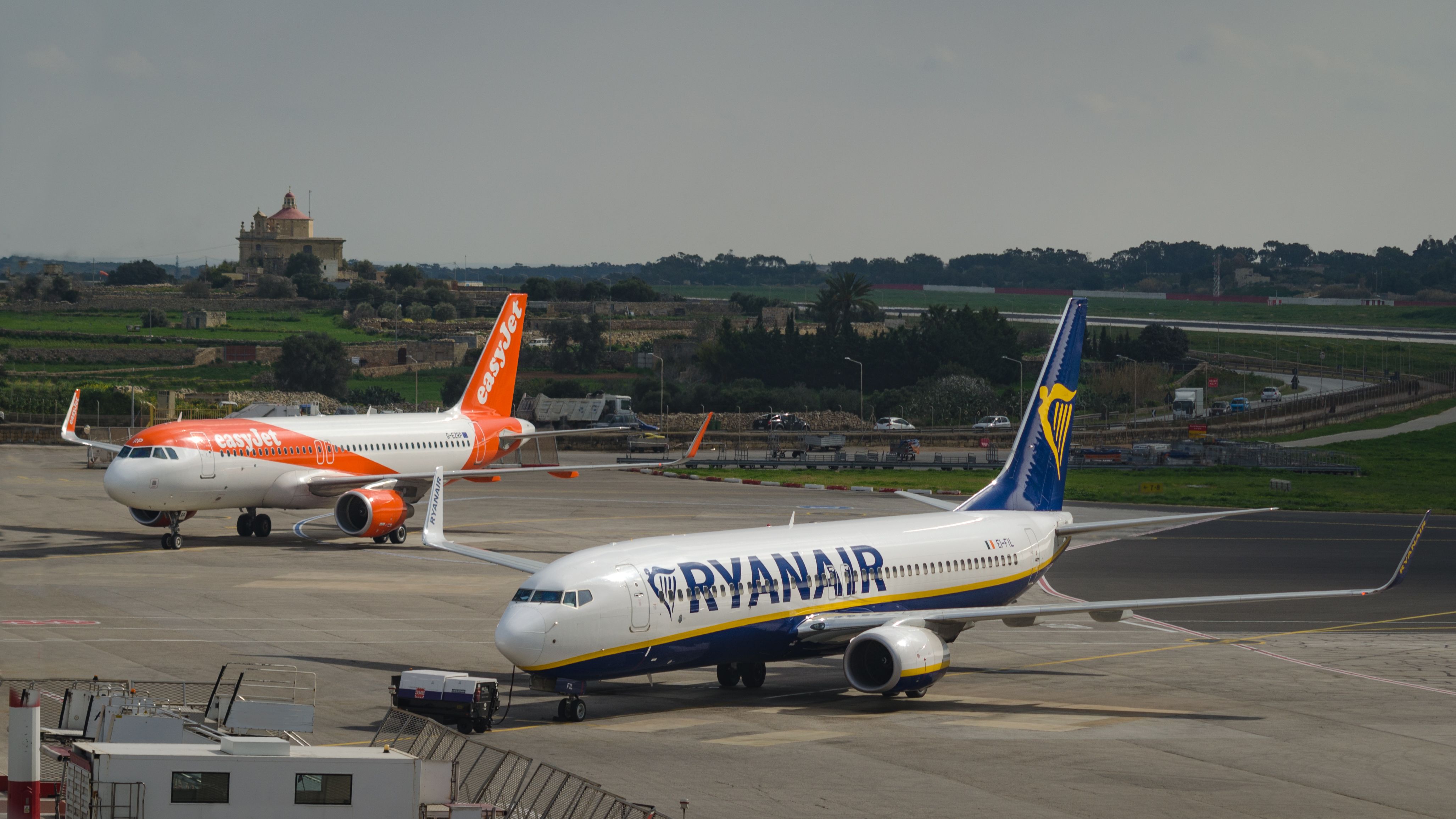 easyJet and Ryanair aircraft on the ground at Malta International Airport.