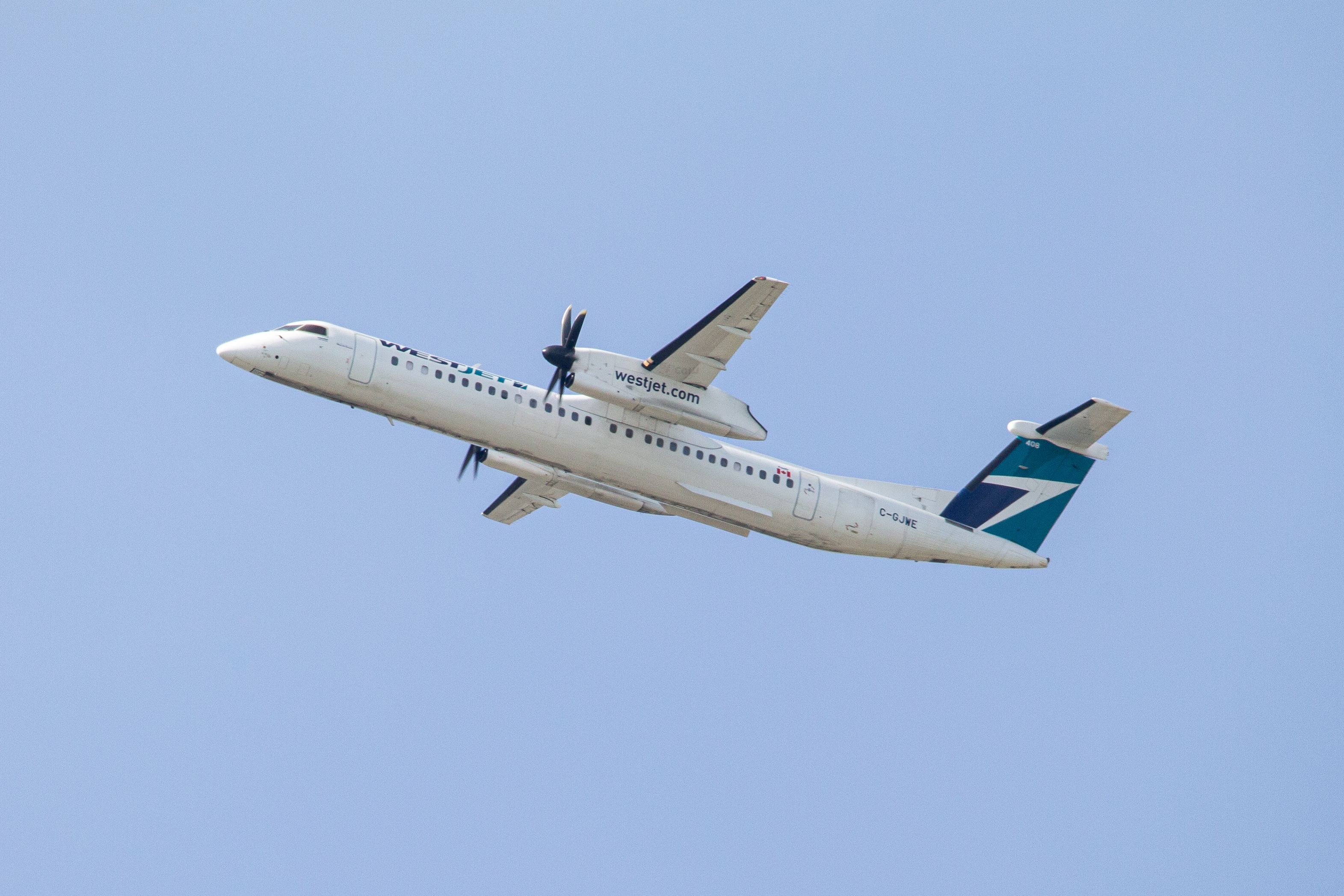 WestJet Encore C-GJWE Bombardier Q400 (Dash-8) heading out to Yellowknife Airport from Calgary International Airport