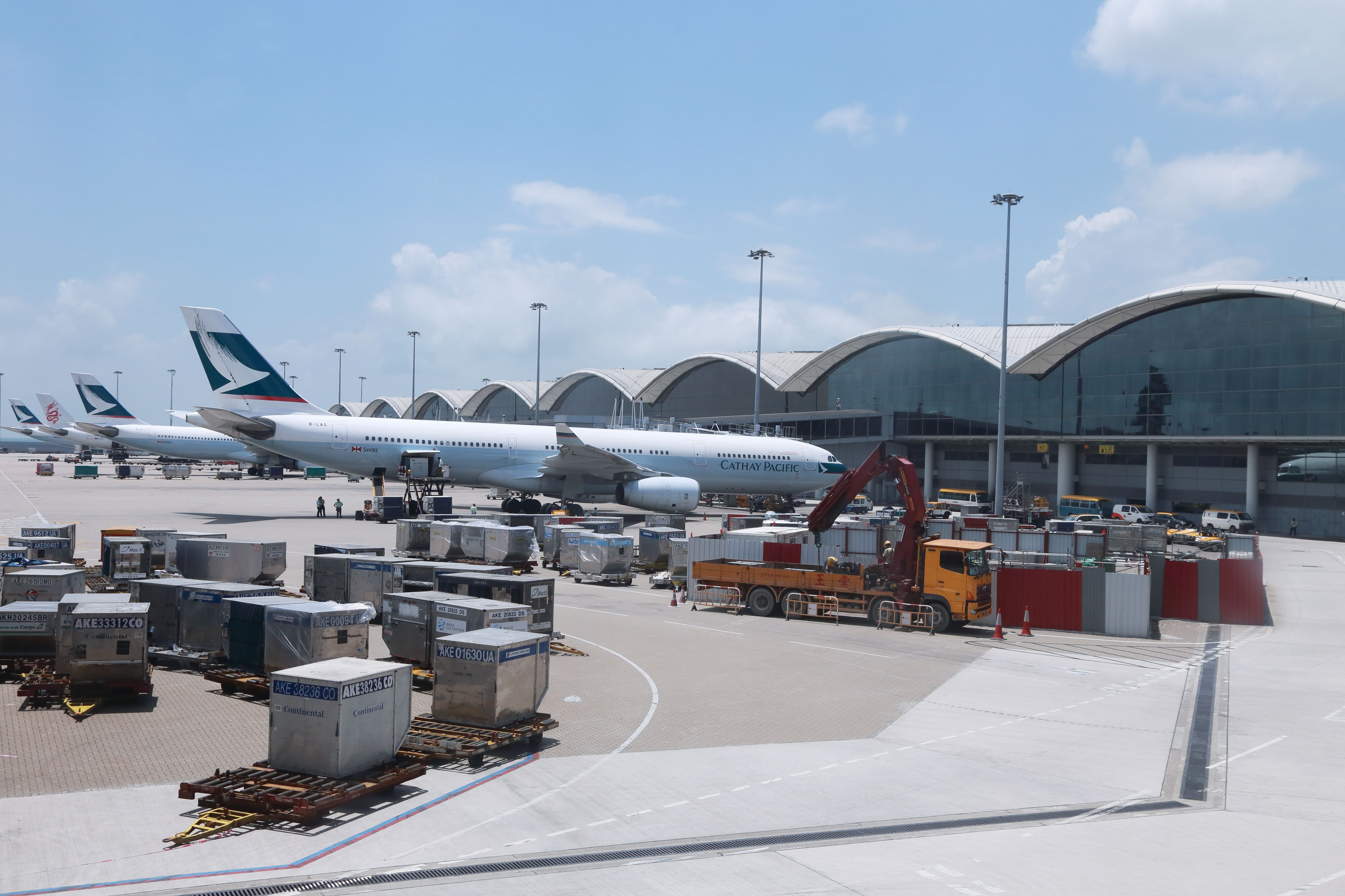 shutterstock_144285229 - JUNE 29 2013: Cathay Pacific plane ready for boarding in Hong Kong Airport on 29 June 2013. 
