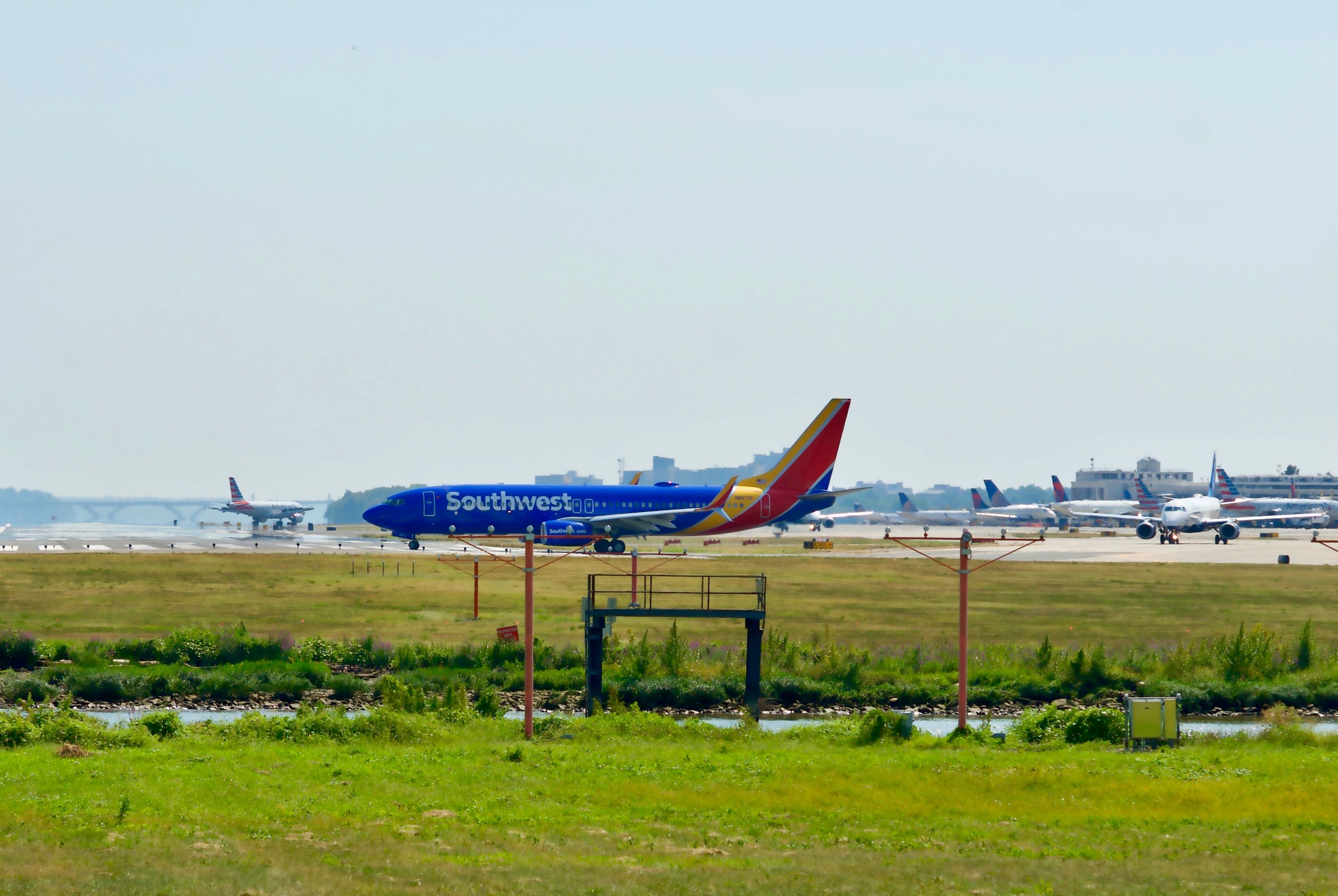 shutterstock_1538785259 - September 11, 2019: A Southwest Airlines Boeing 737 aircraft turns onto the runway in preparation for taking off from Ronald Reagan Washington National Airport (DCA).