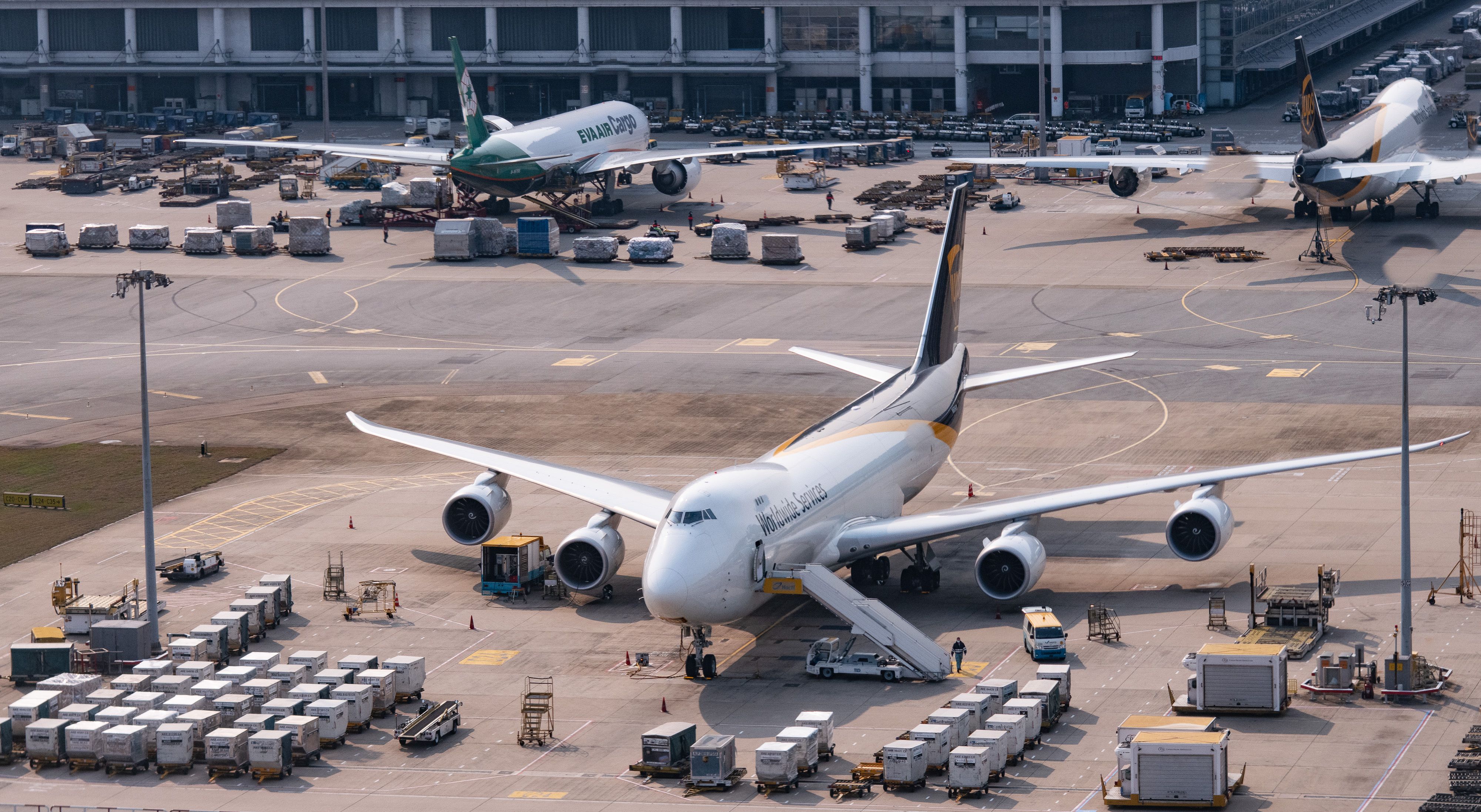 shutterstock_1724065009 - UPS Cargo Aircraft sit parked on the tarmac at Hong Kong International Airport amid travel restrictions as a result of the COVID-19 pandemic, on February 17, 2020, in Hong Kong, China. Photo by Victor