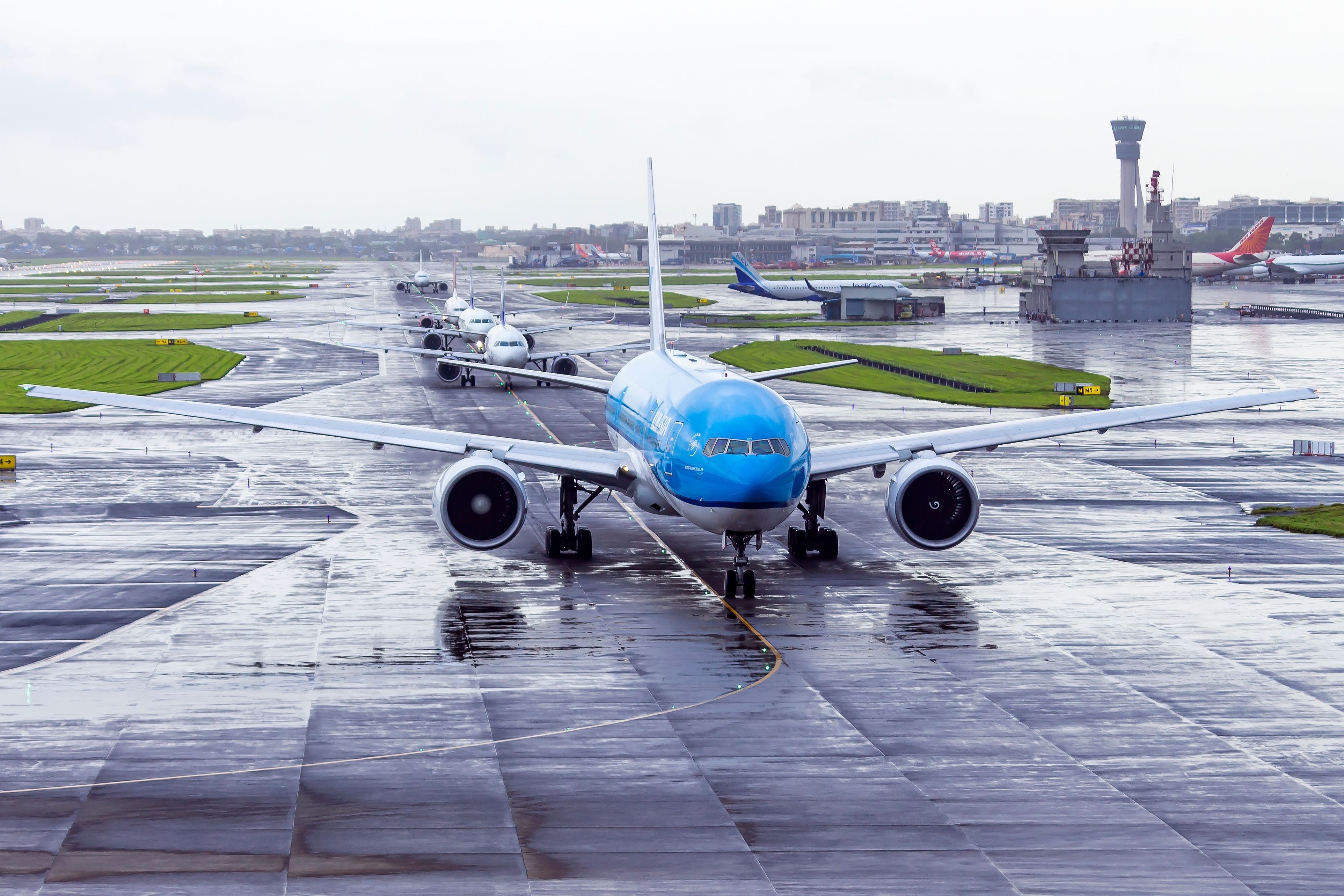 A KLM 777 lined up for takeoff at Mumbai Airport.