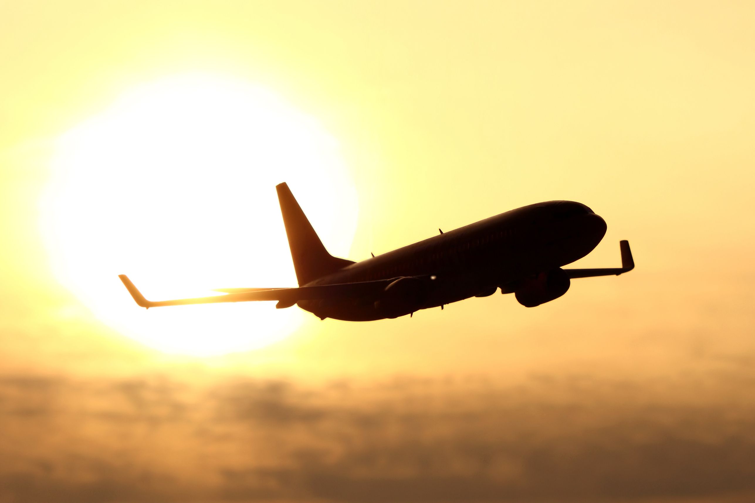 Boeing 737 silhouette in sunset.