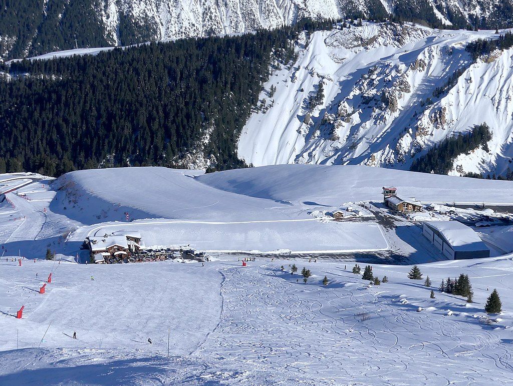 An aerial view of the Altiport de Courchevel covered in snow.