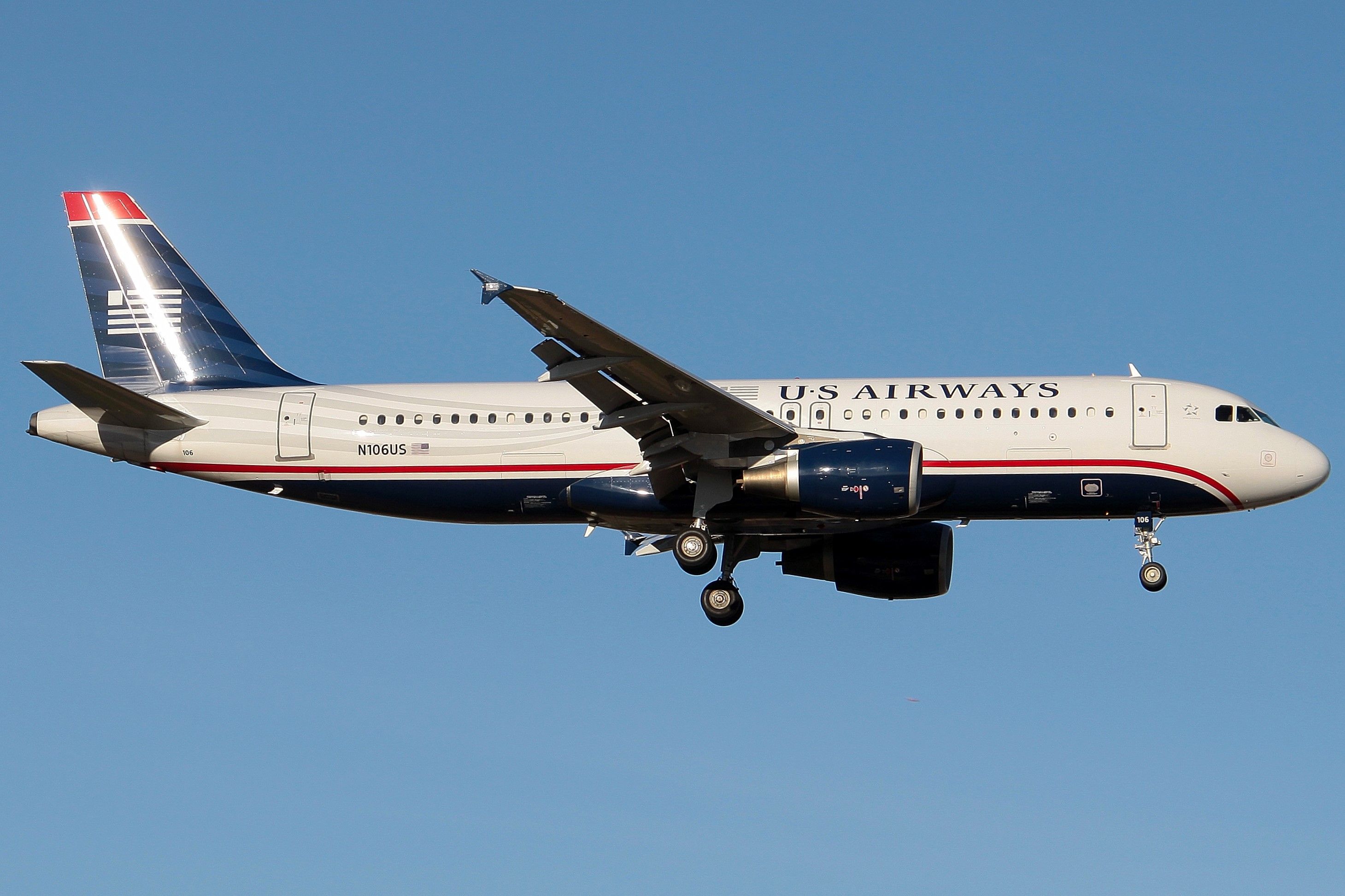 A US Airways Airbus A320 flying in the sky.