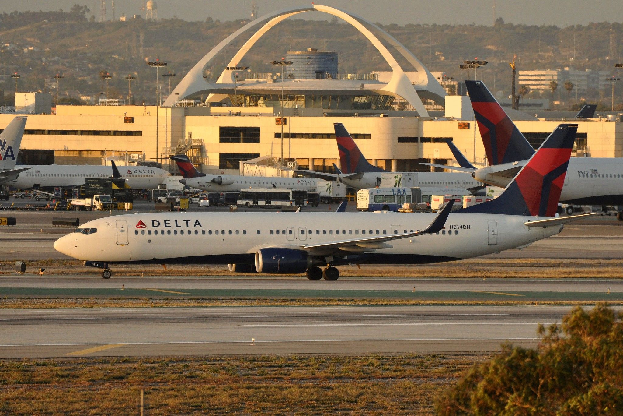 A Delta Air Lines Boeing 737-900ER, registration N814DN, on the taxiway. 