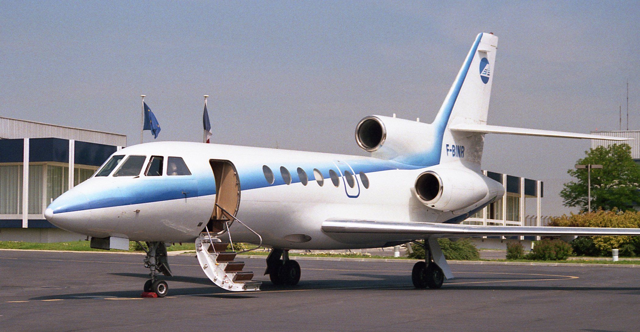 A Dassault Falcon 50 parked and ready for passengers to board.
