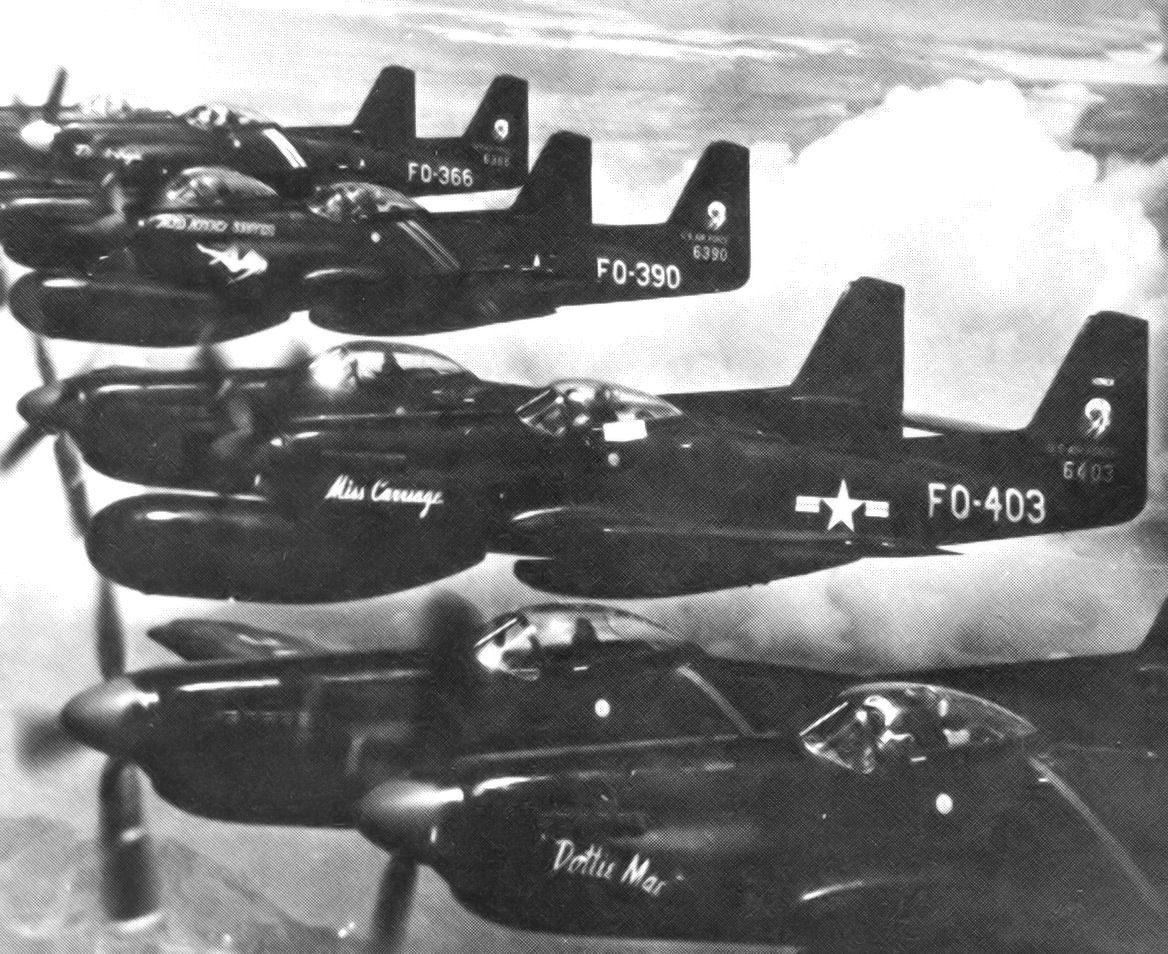 Many North American F-82Gs flying side by side.