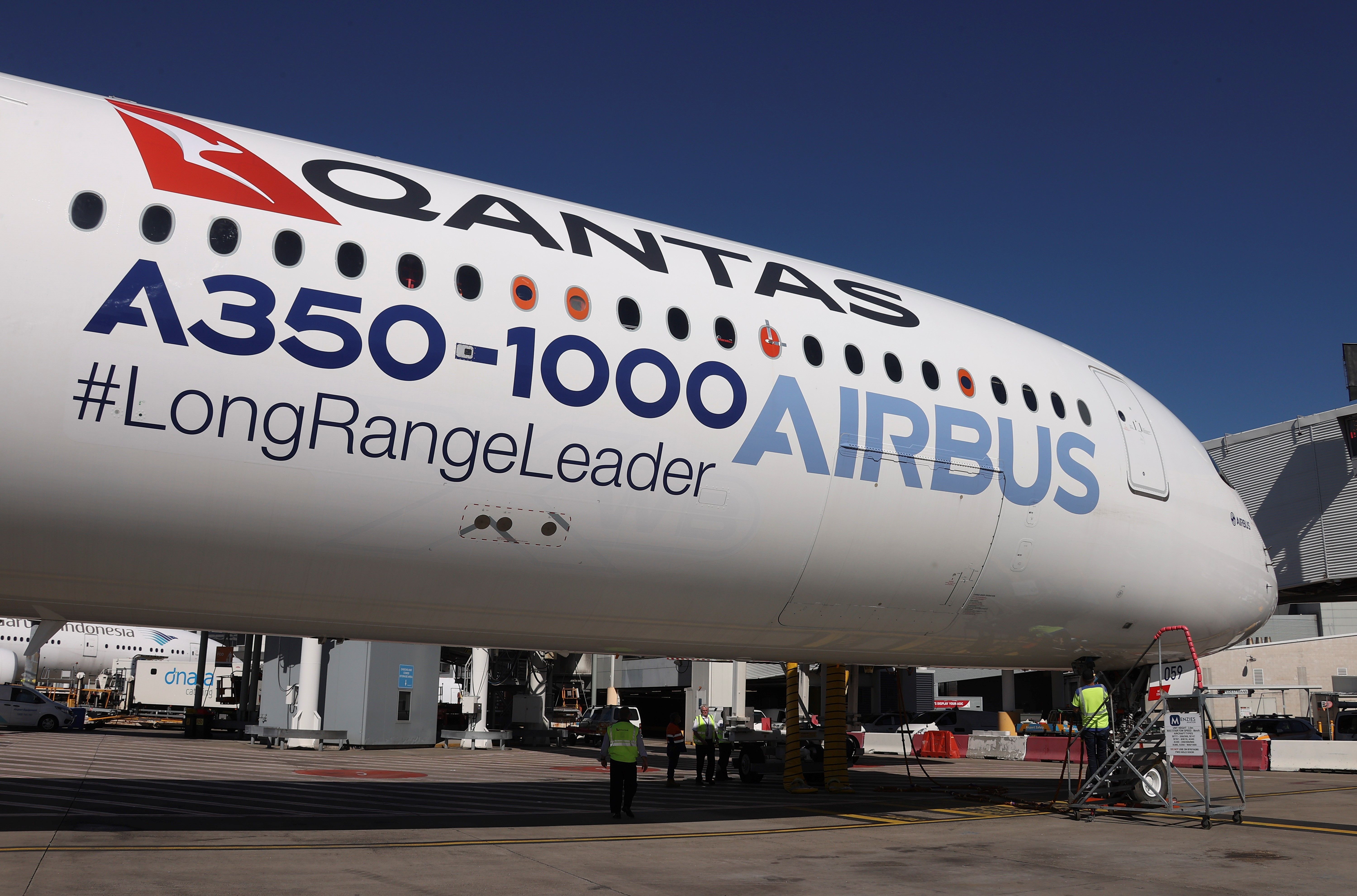 A Qantas Airbus A350-1000 parked at the airport.