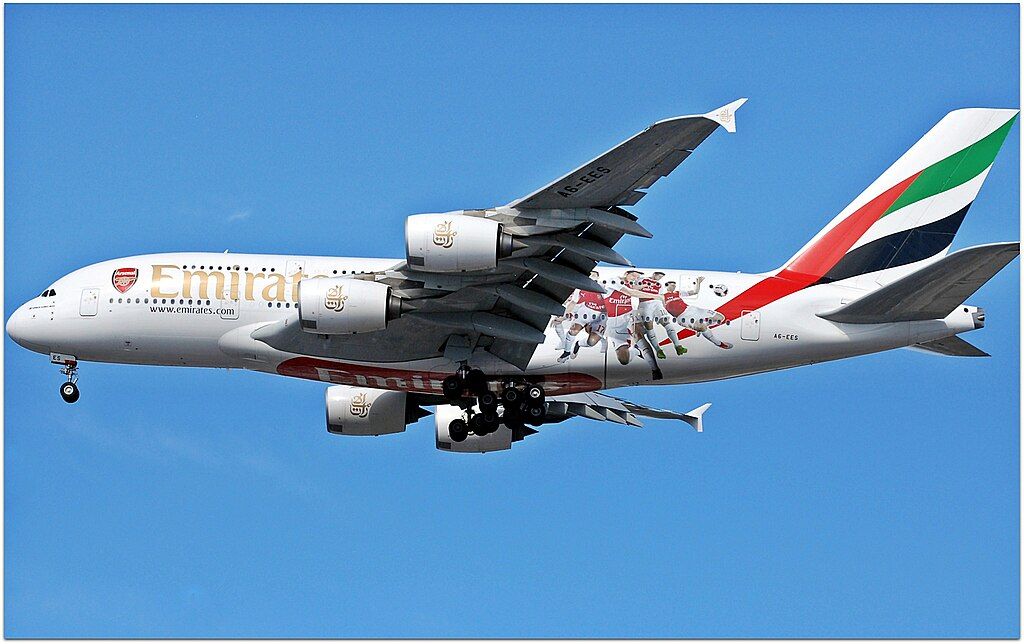 An Emirates A380 flying in the sky.