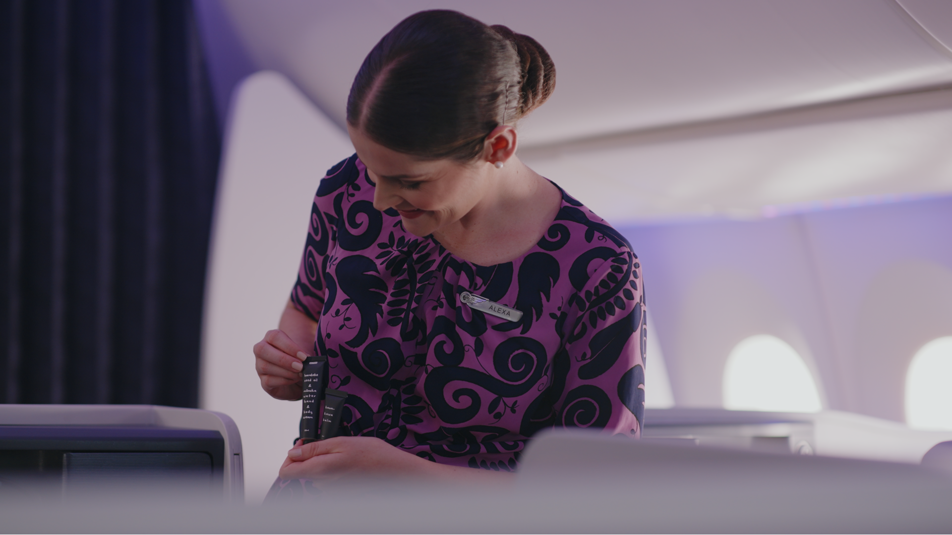 Air New Zealand flight attendant with Aotea amentiy kit products