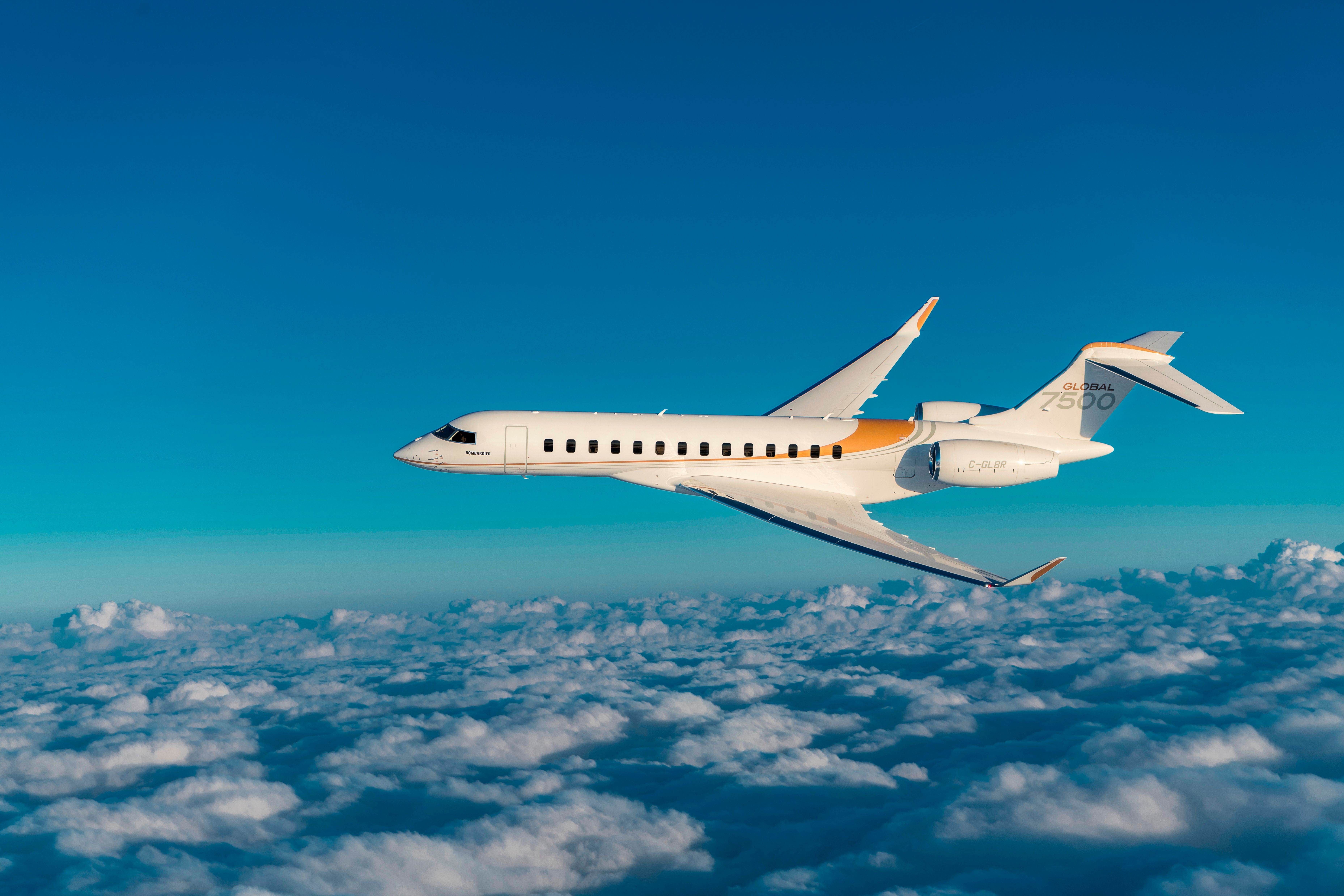 A Bombardier Global 7500 flying above the clouds.