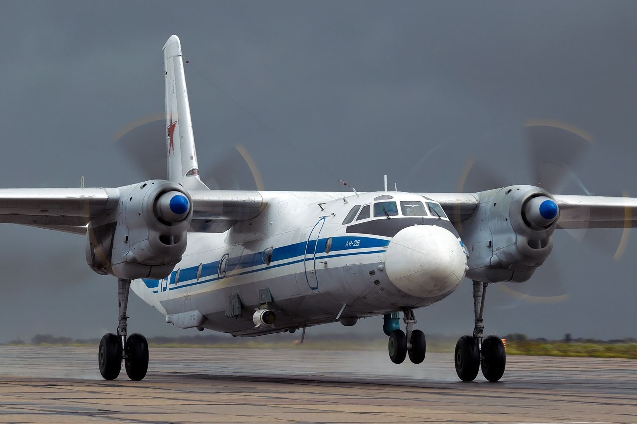 An Antonov An-26 of the Russian Air Force touching down on the runway. 