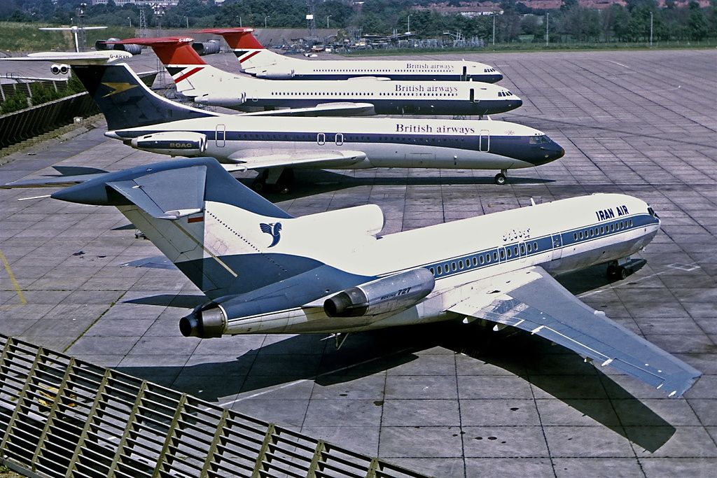 An Iran Air Boeing 727 parked next to British Airways jets.