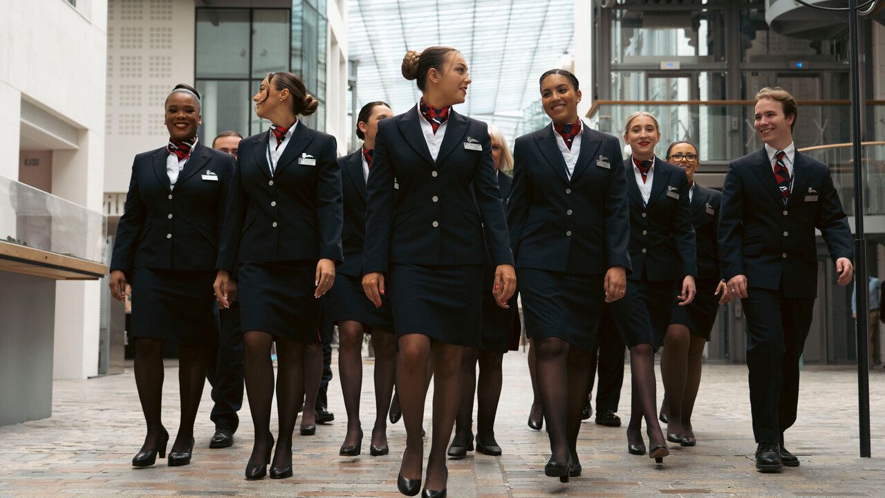 British Airways cabin crew walking together.