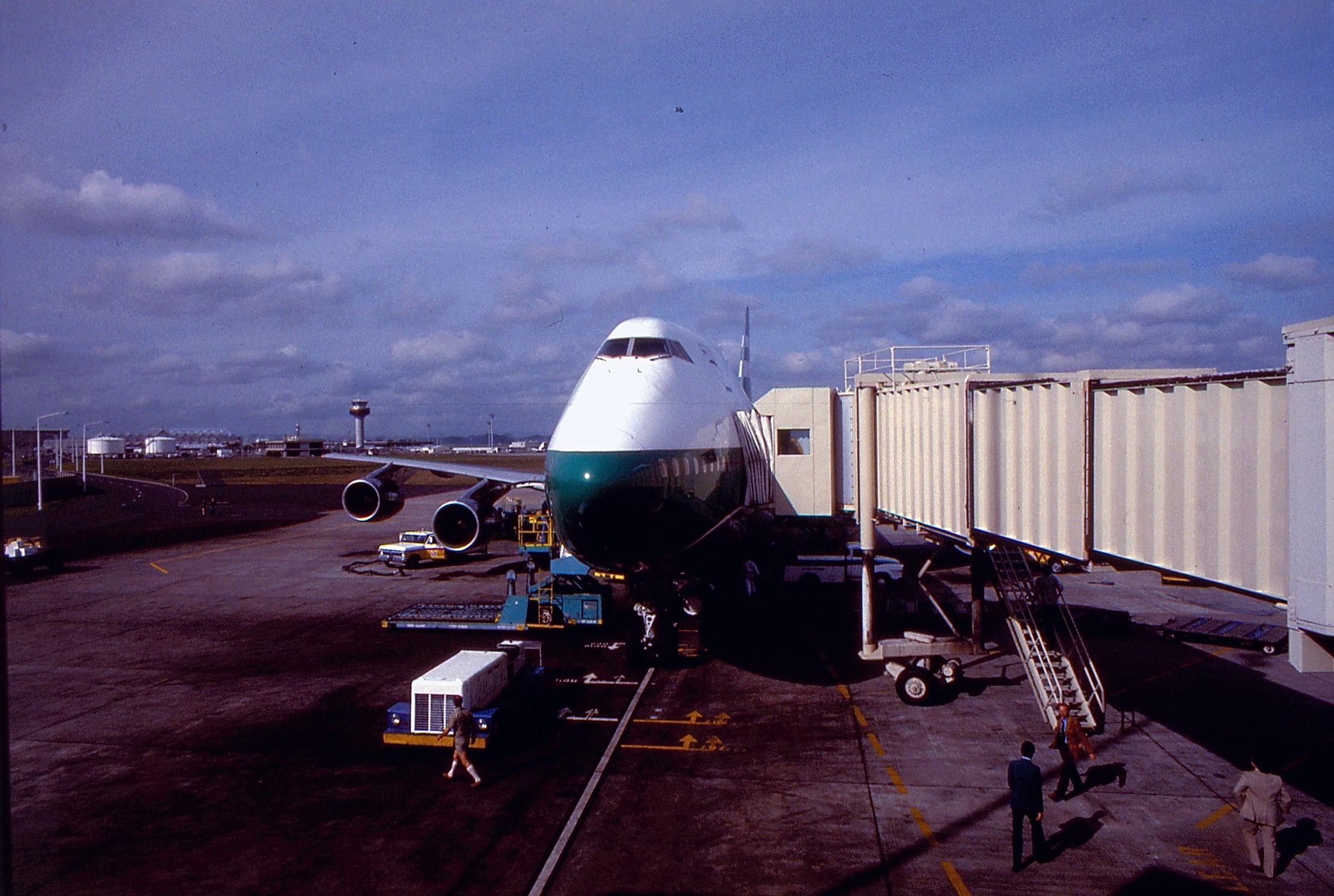 A Cathay Pacific Boeing 747-200 parked at the gate.