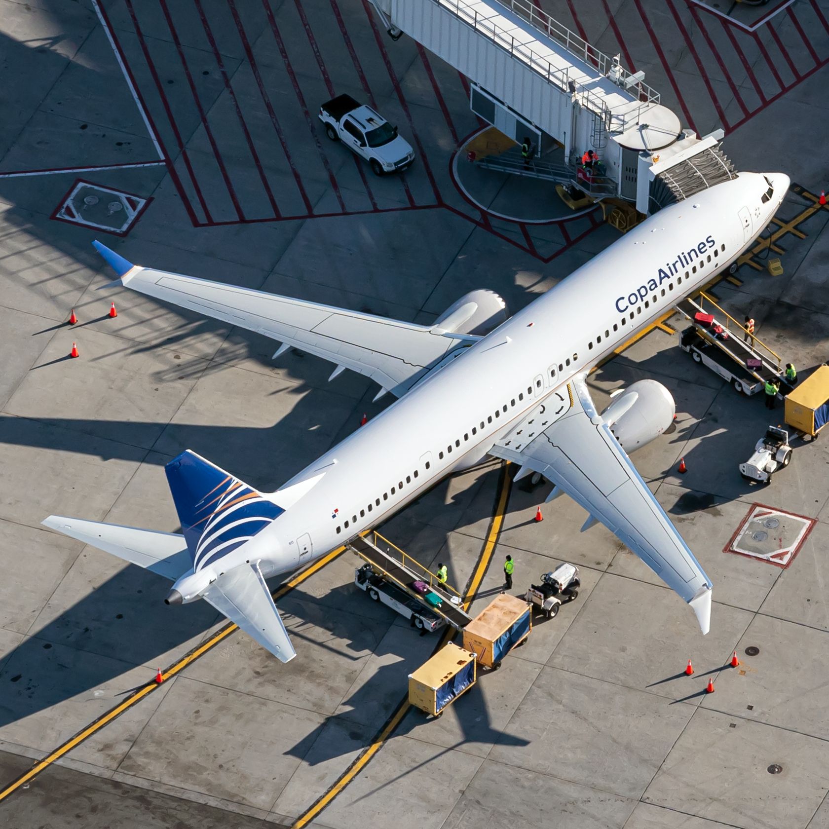 A Copa Airlines Boeing 737-800 Parked on an airport apron at a gate.