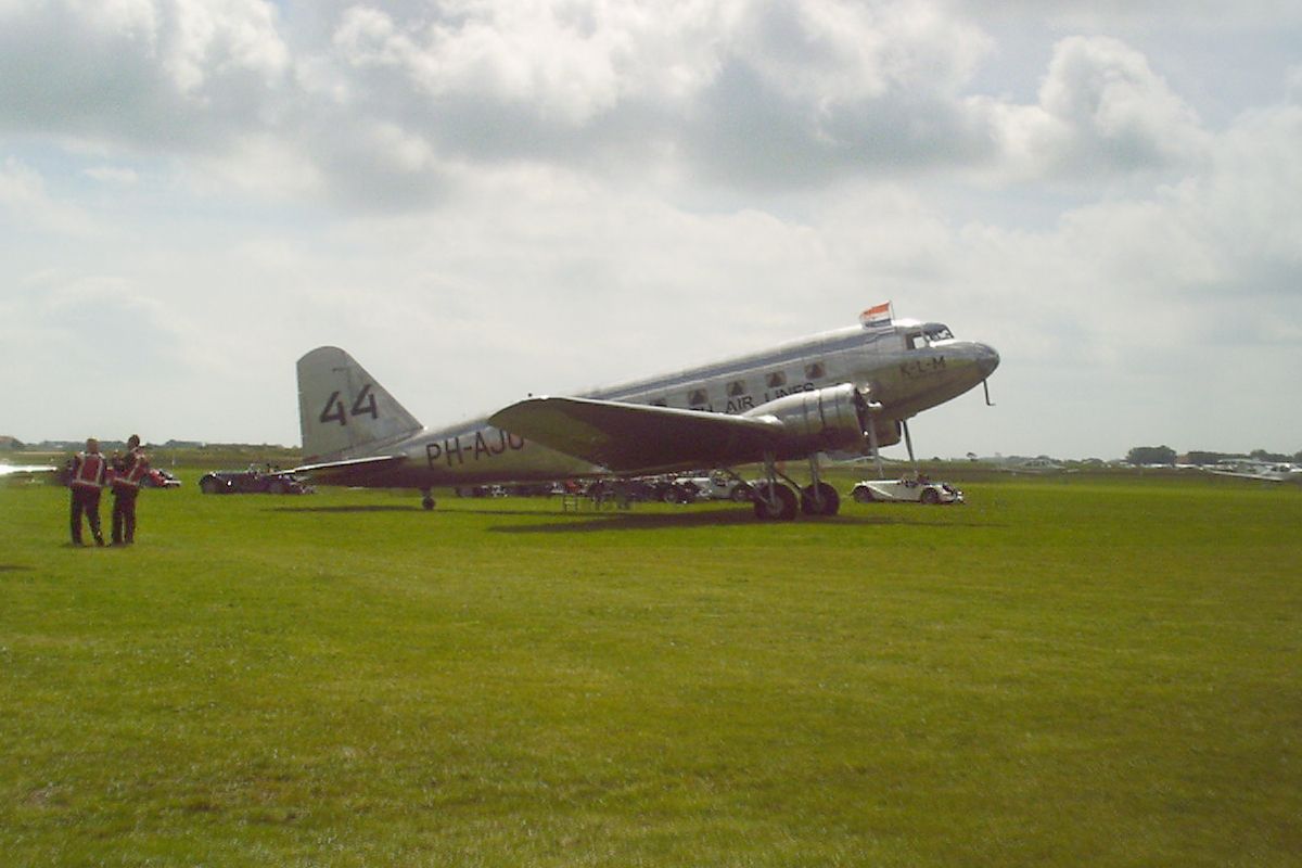 A Douglas DC-2 sitting in the field.