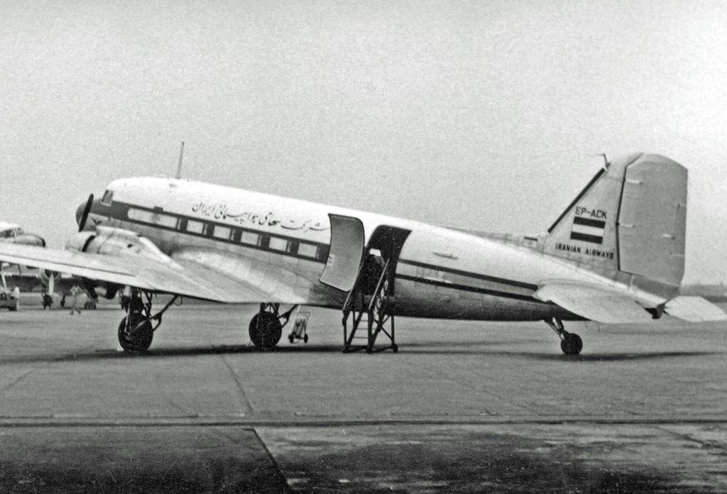 An Iranian Airways Company DouglasC-47B parked at an airfield. 