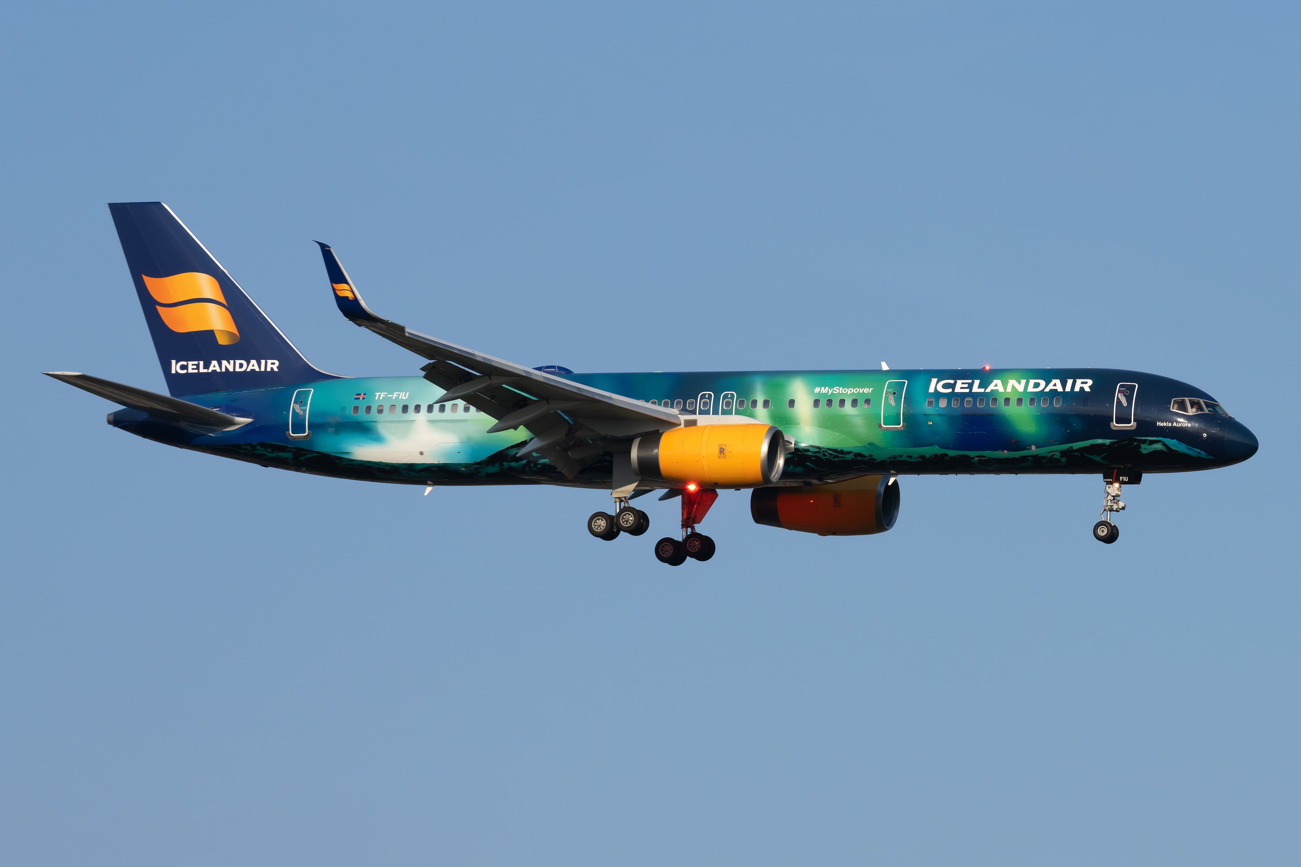 An Icelandair Boeing 757-200 in Northern Lights Livery flying in the sky.