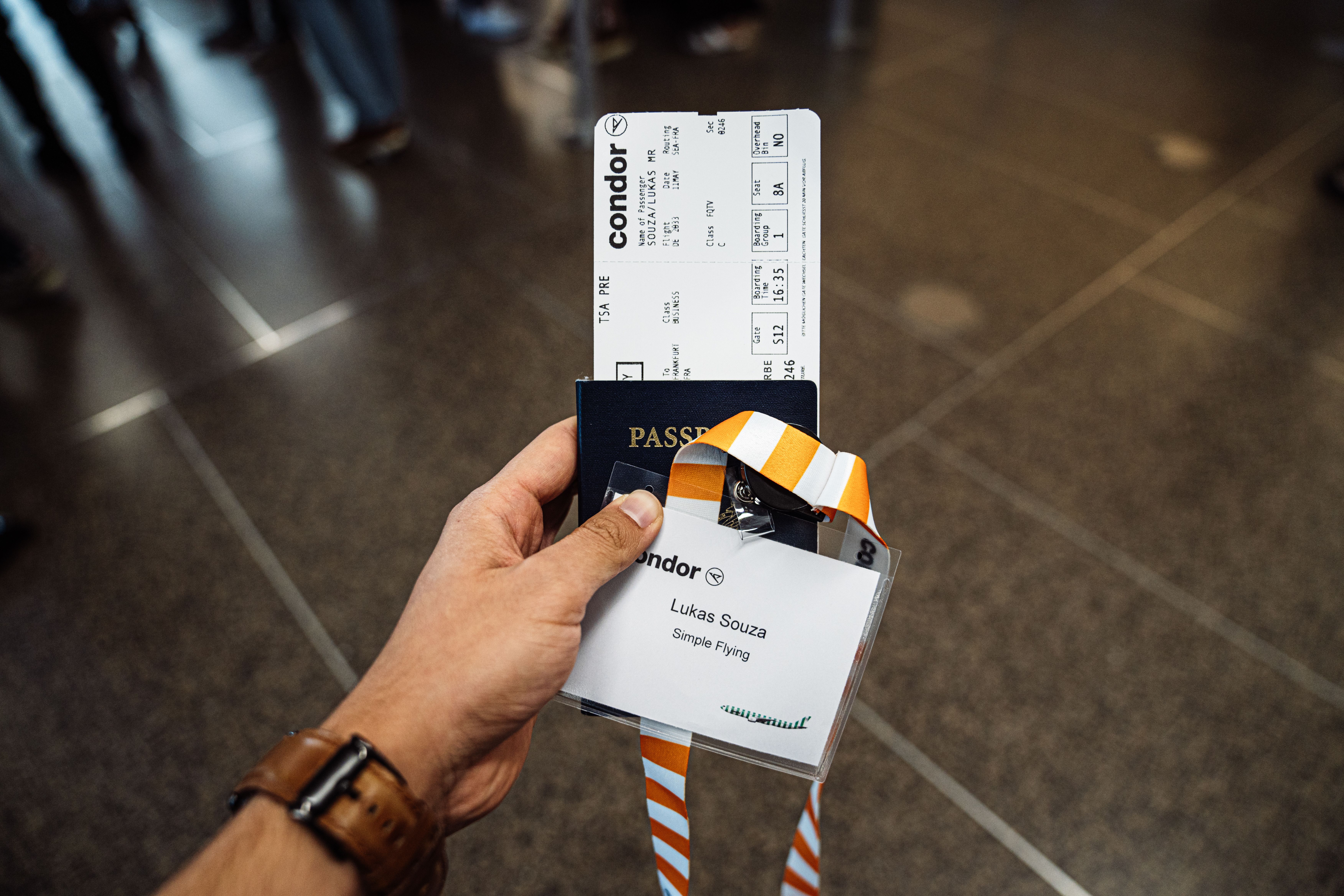 Condor nametag, passport, and boarding pass