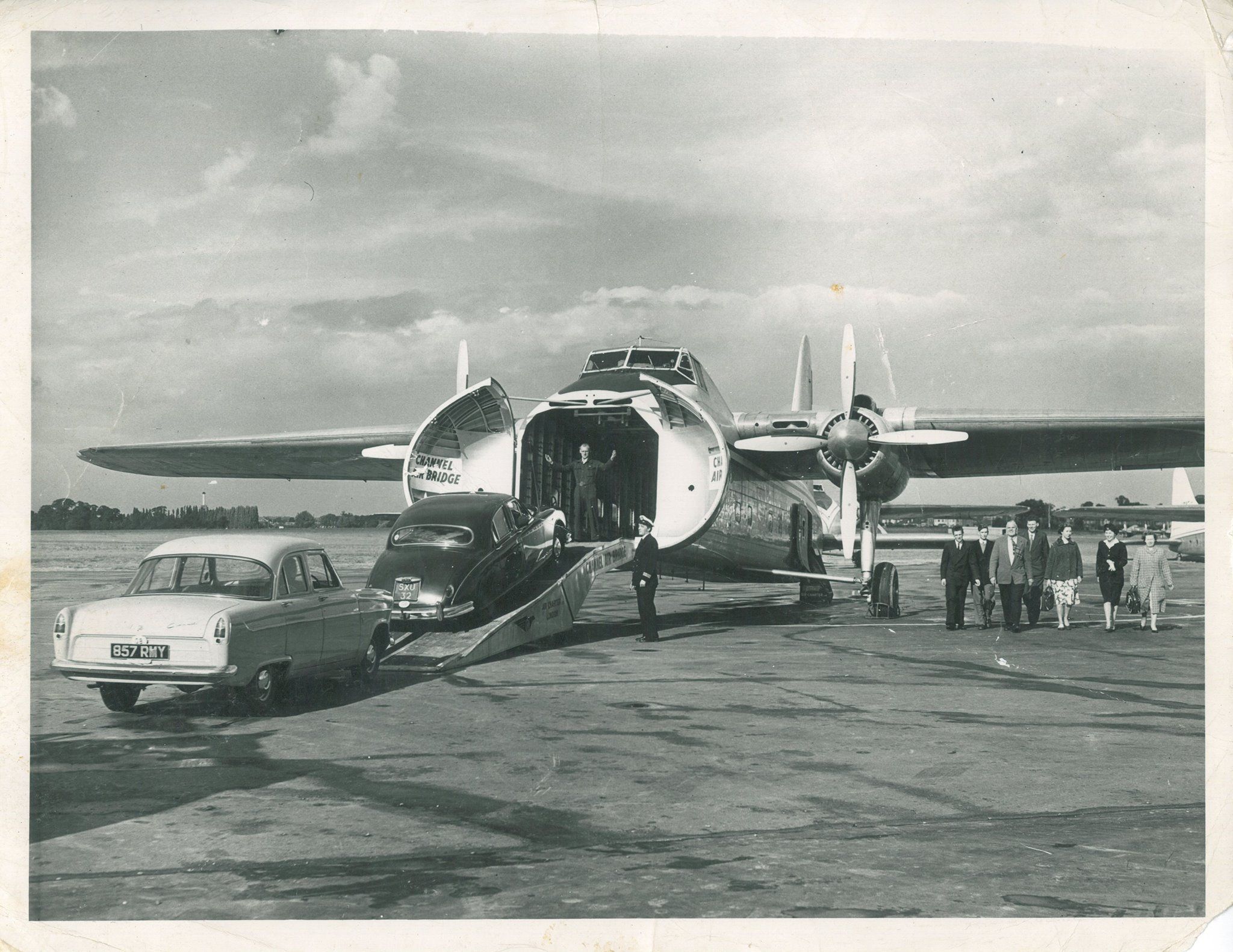 Cars being loaded into a friehgter aircraft.