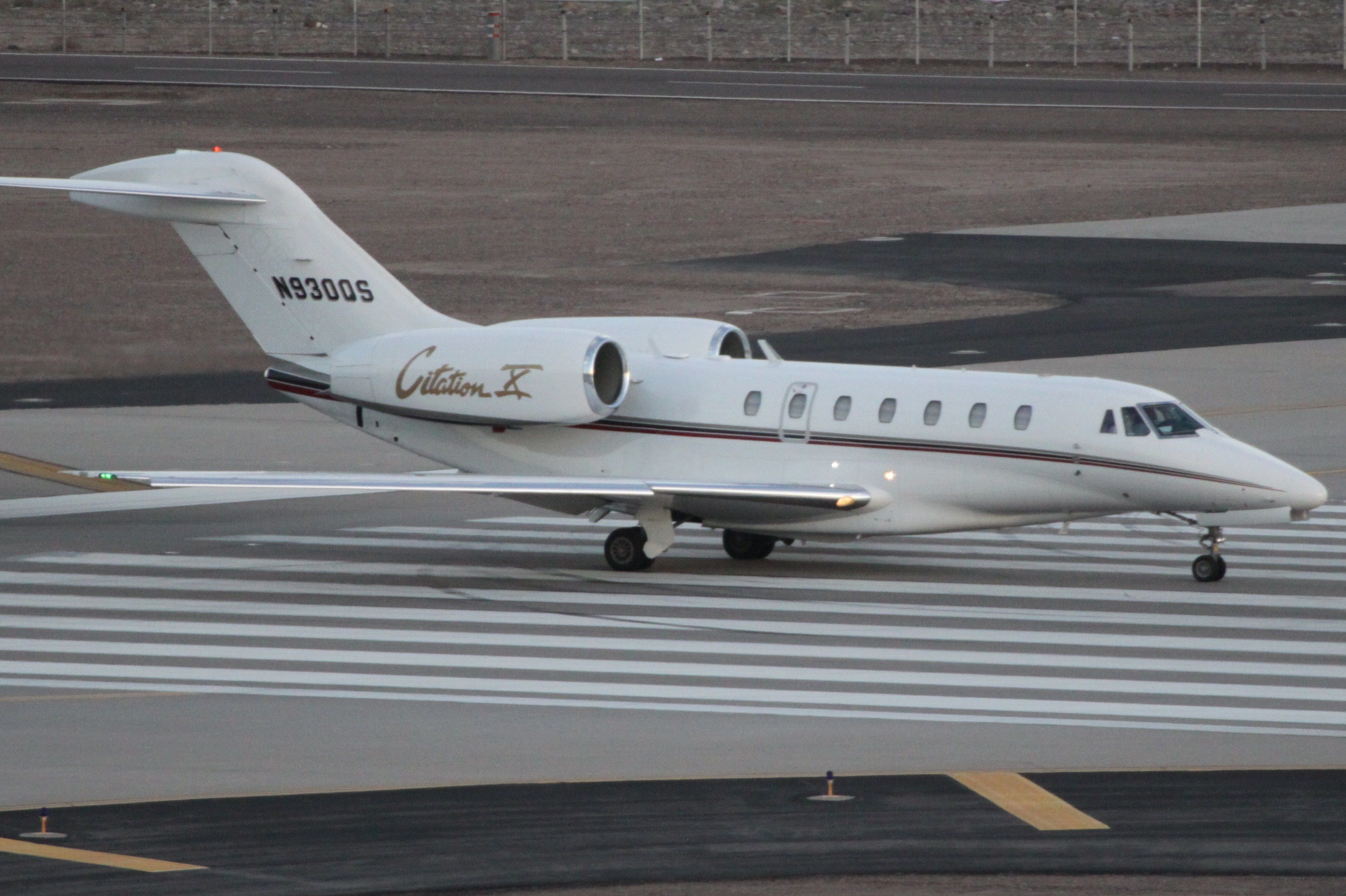 A Cessna Citation X lined up on the runway.