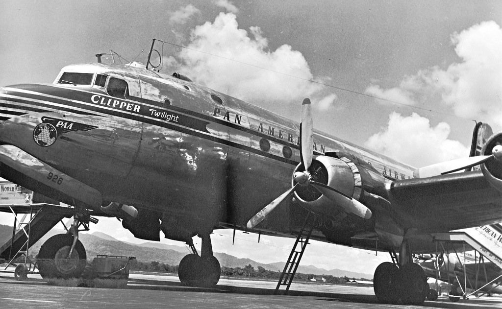 A Pan Am DC-4 parked at an airport.