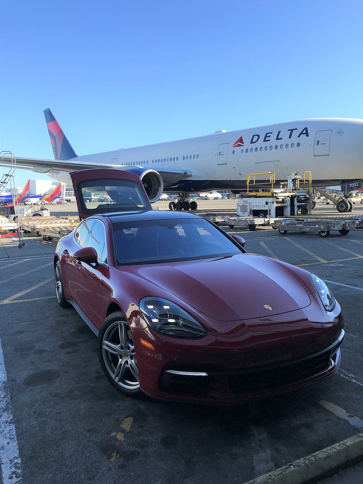 A red Delta Air Lines Porsche used to transfer passengers at SeaTac airport.