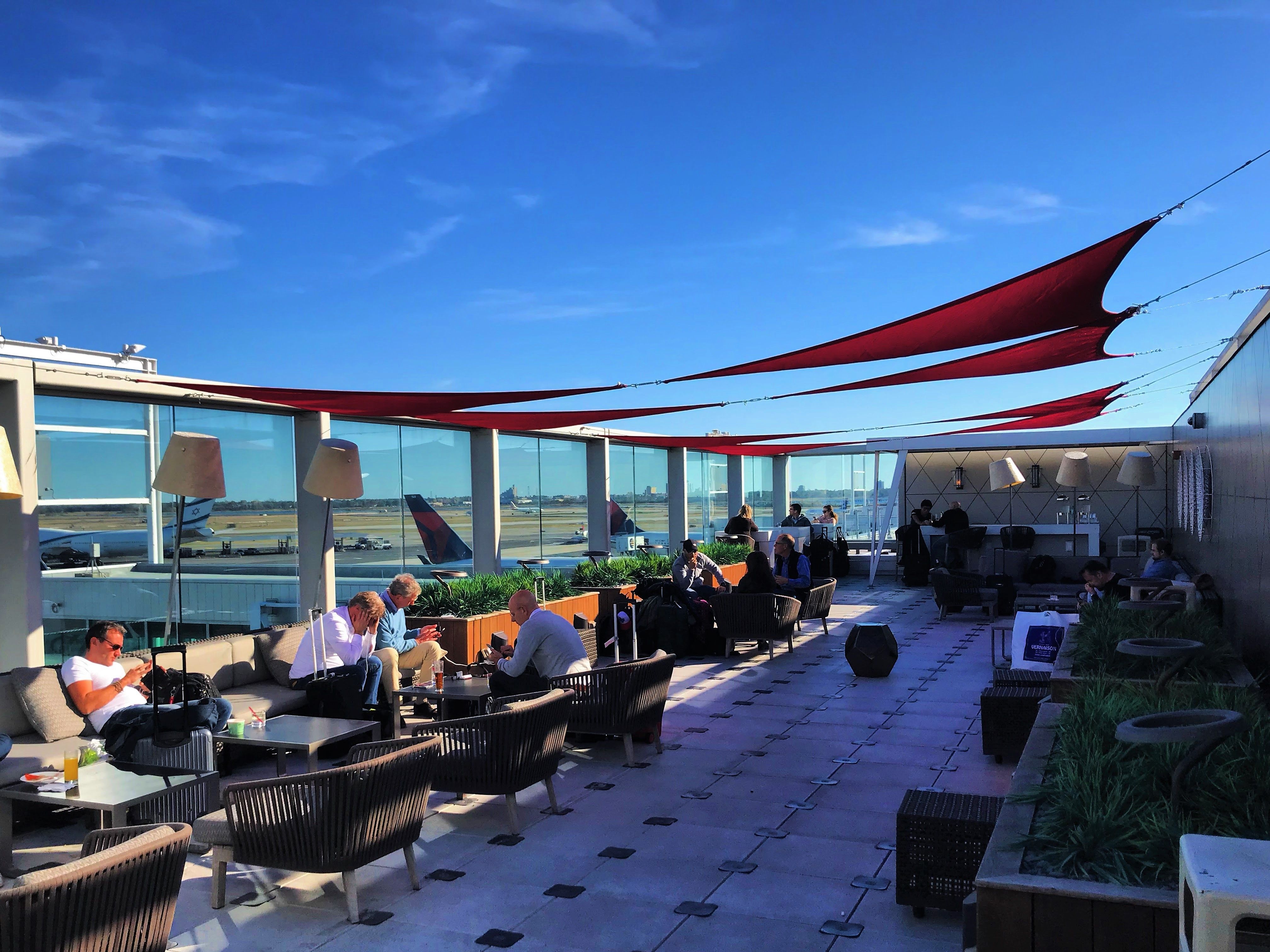 View of the outdoor terrace of a Delta Sky Club lounge.