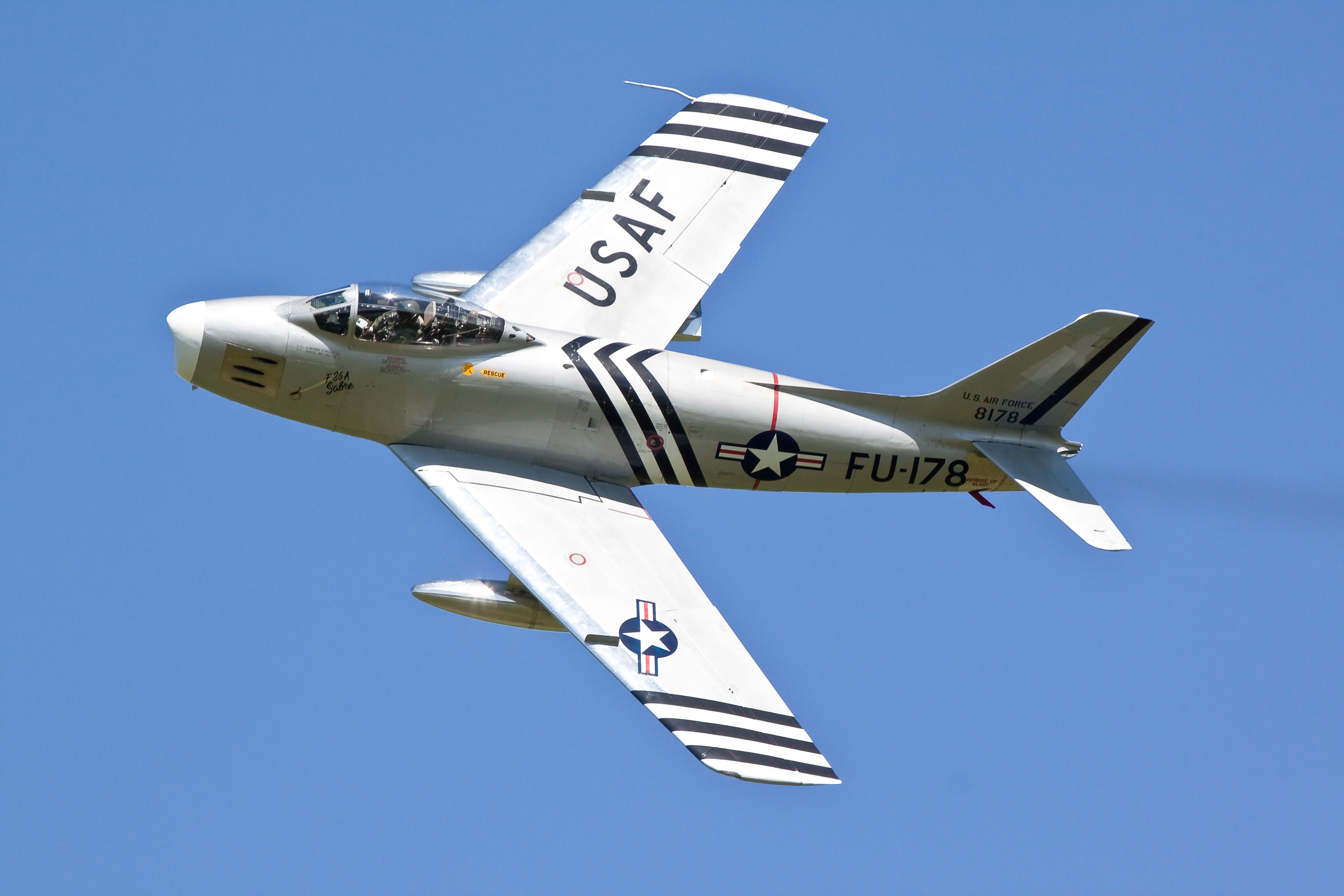 An F-86A Sabre flying in the sky.
